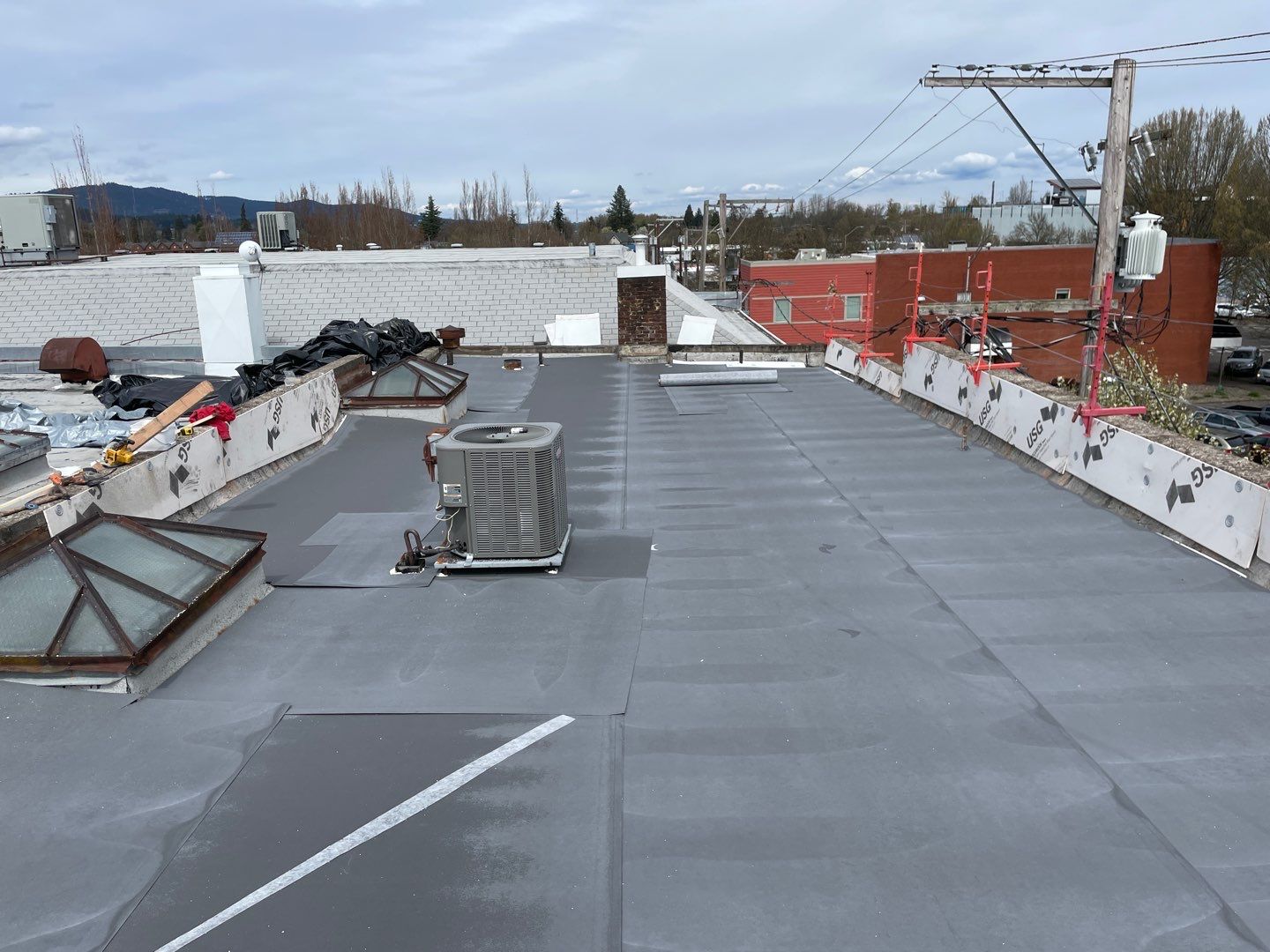 Commercial Flat Roof Installation using GAF 60Mil TPO  by Orezona Building & Roofing Company, Inc.