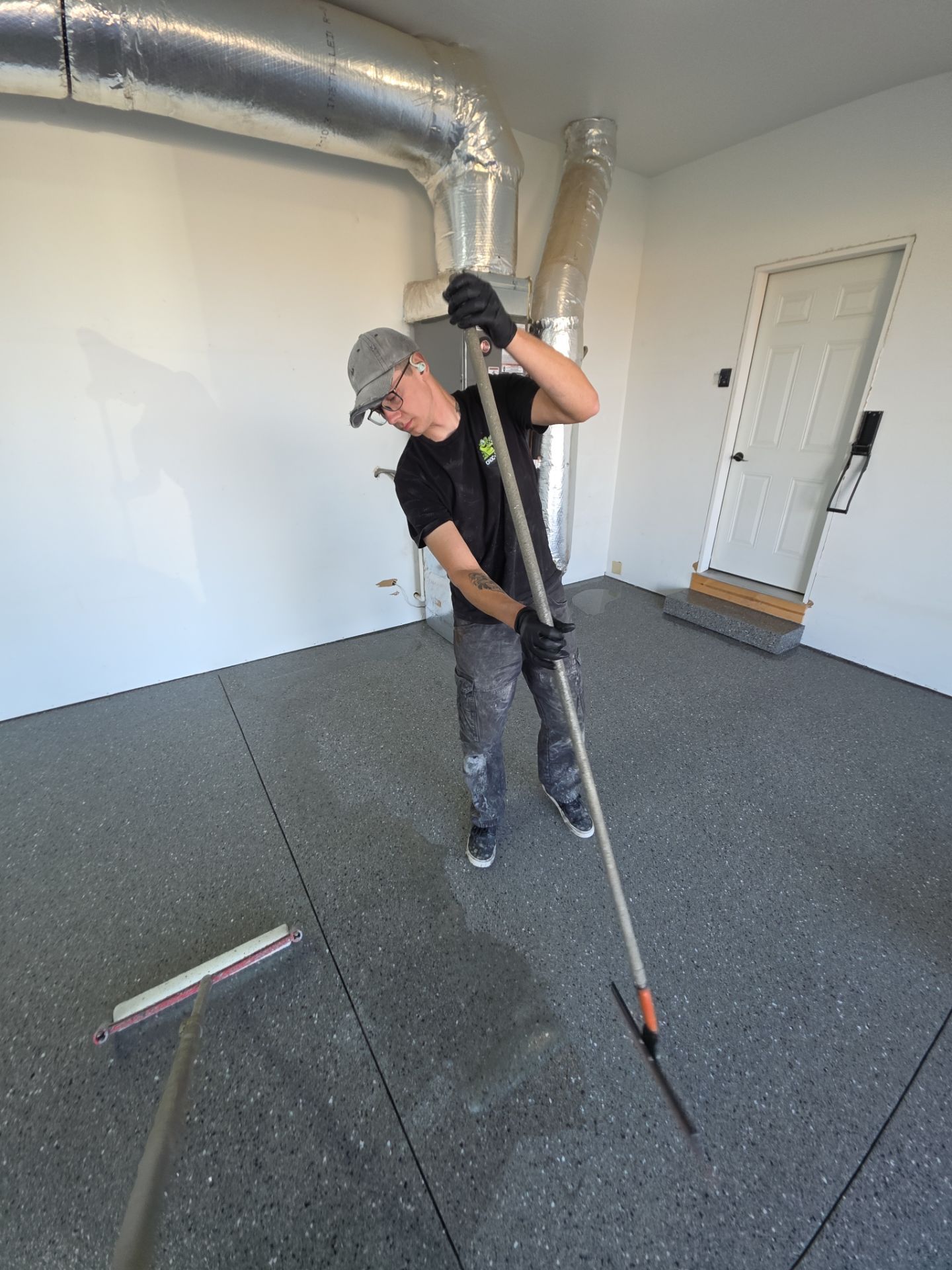 Polyaspartic Garage Floor Coating With Slate Hybrid Flake in Davenport by Croc Coatings, LLC
