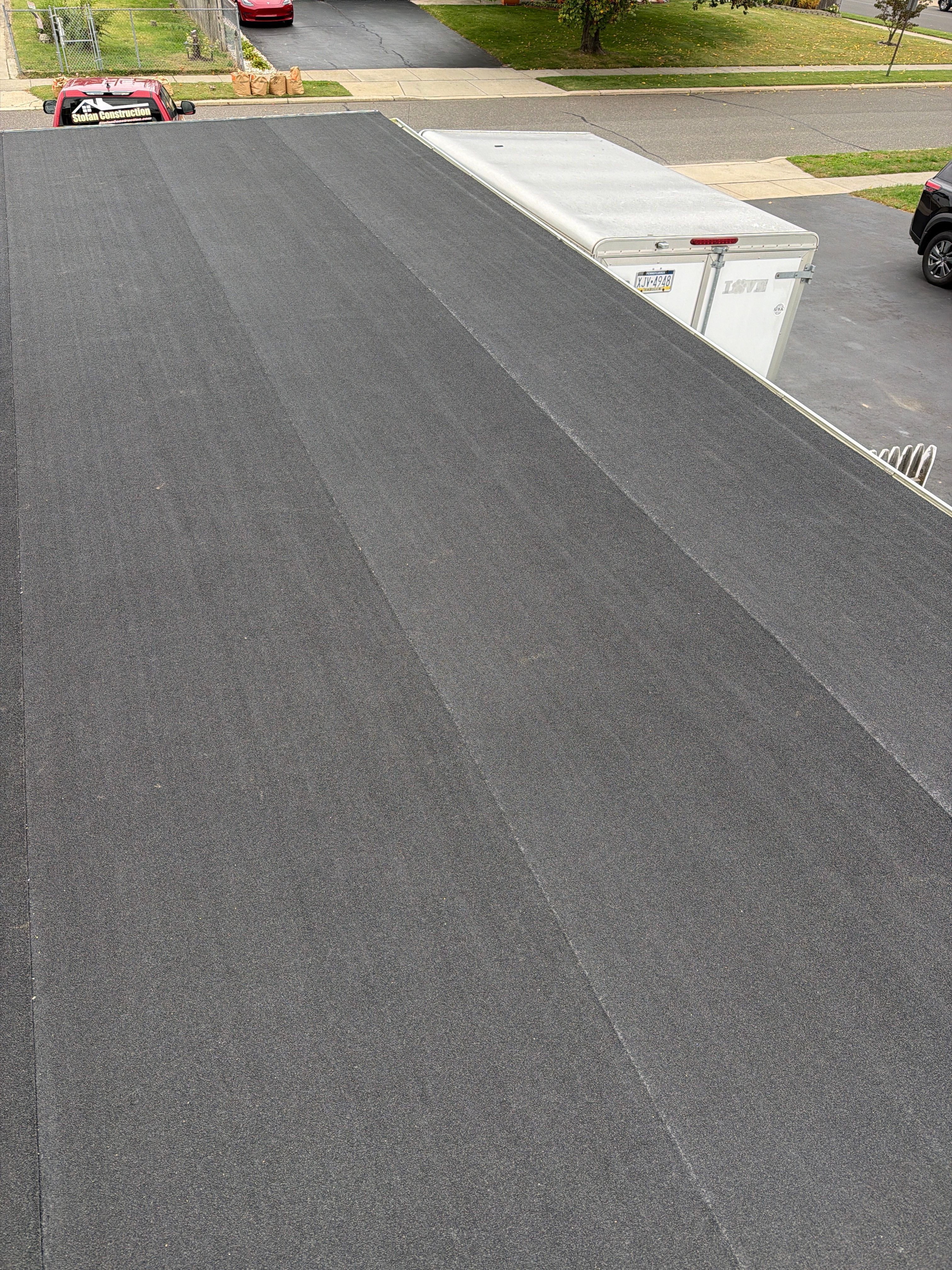Flat Roof Replacement and Shingle Integration in Levittown by Stofan Construction LLC