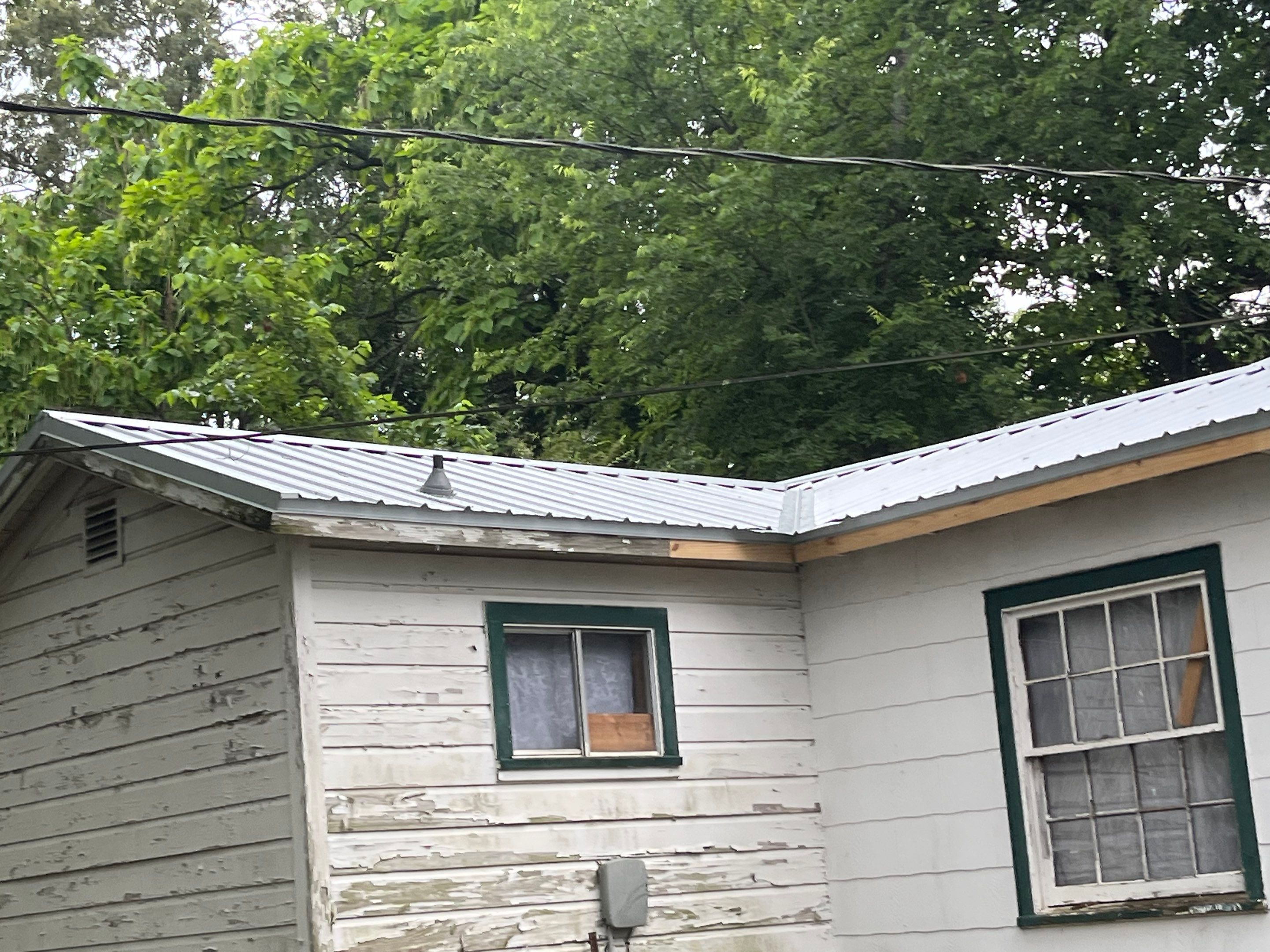 Residential Roofing Installation using 29 Gauge Galvalume Metal by Hostetler Roofing