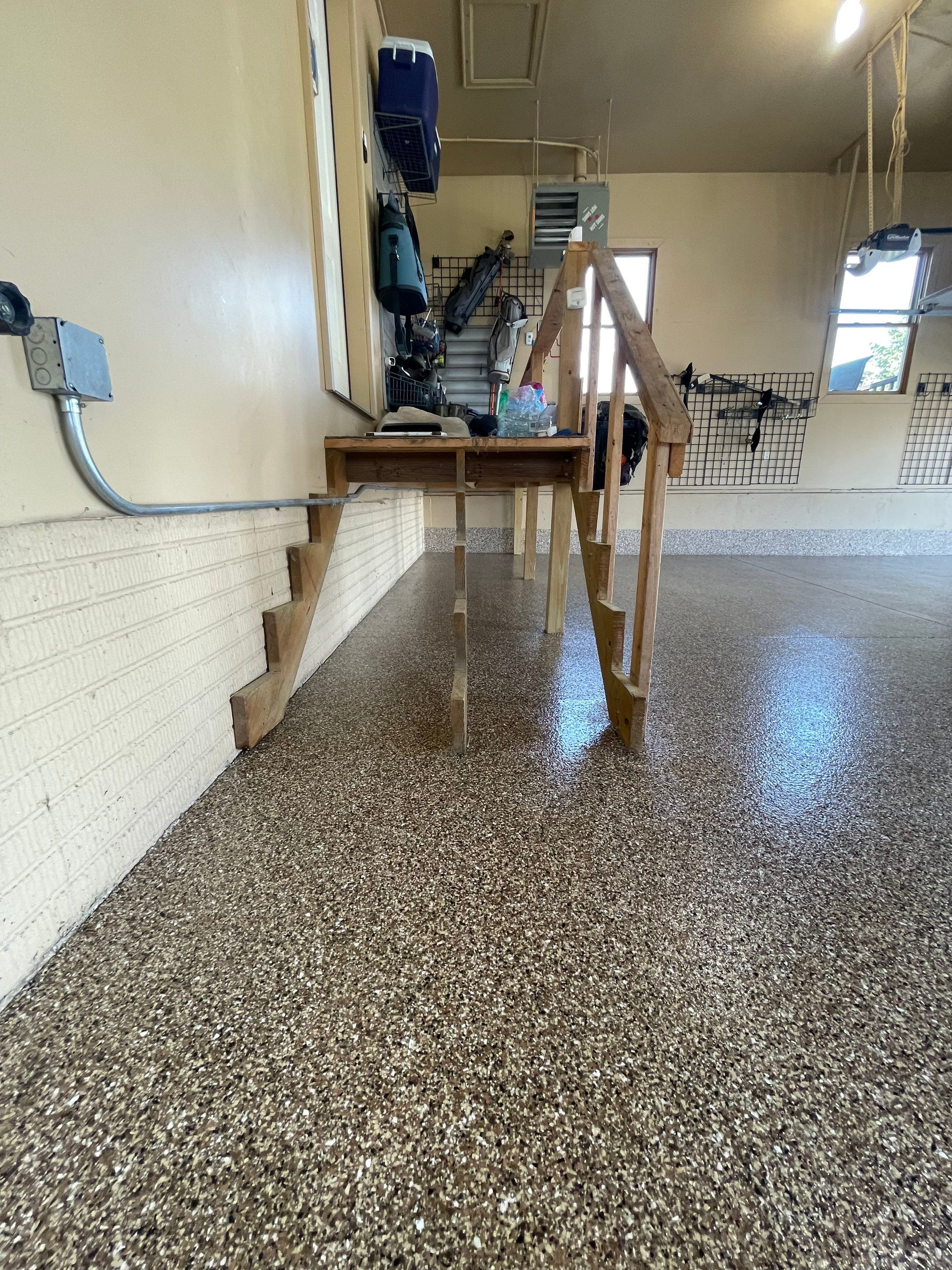 Residential Garage Floor Transformation with Speckled Epoxy Coating by Select Painting, Coatings & Garage Cabinets