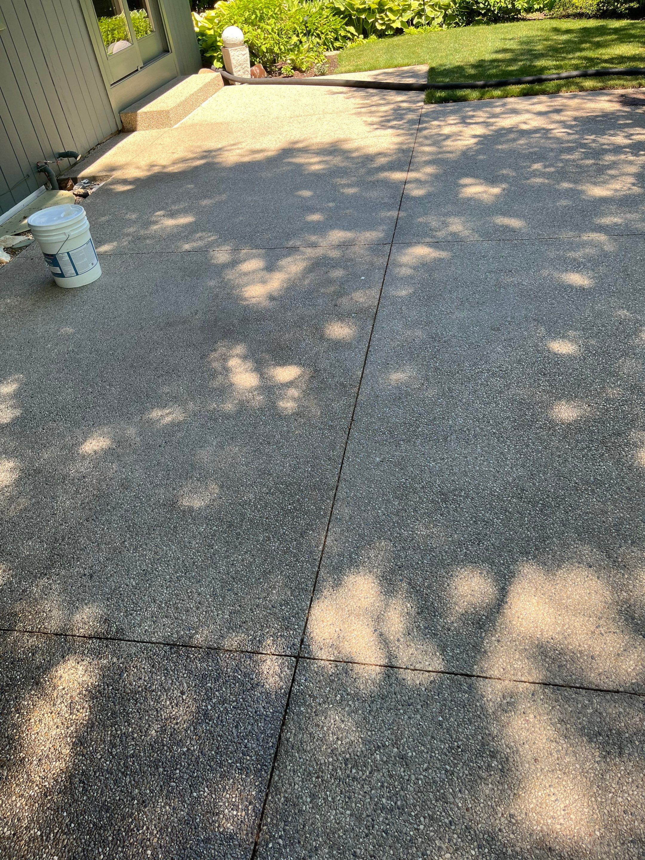 Aggregate concrete cleaning and sealing using Surebond SB-9000 by Northern Power Washing LLC.