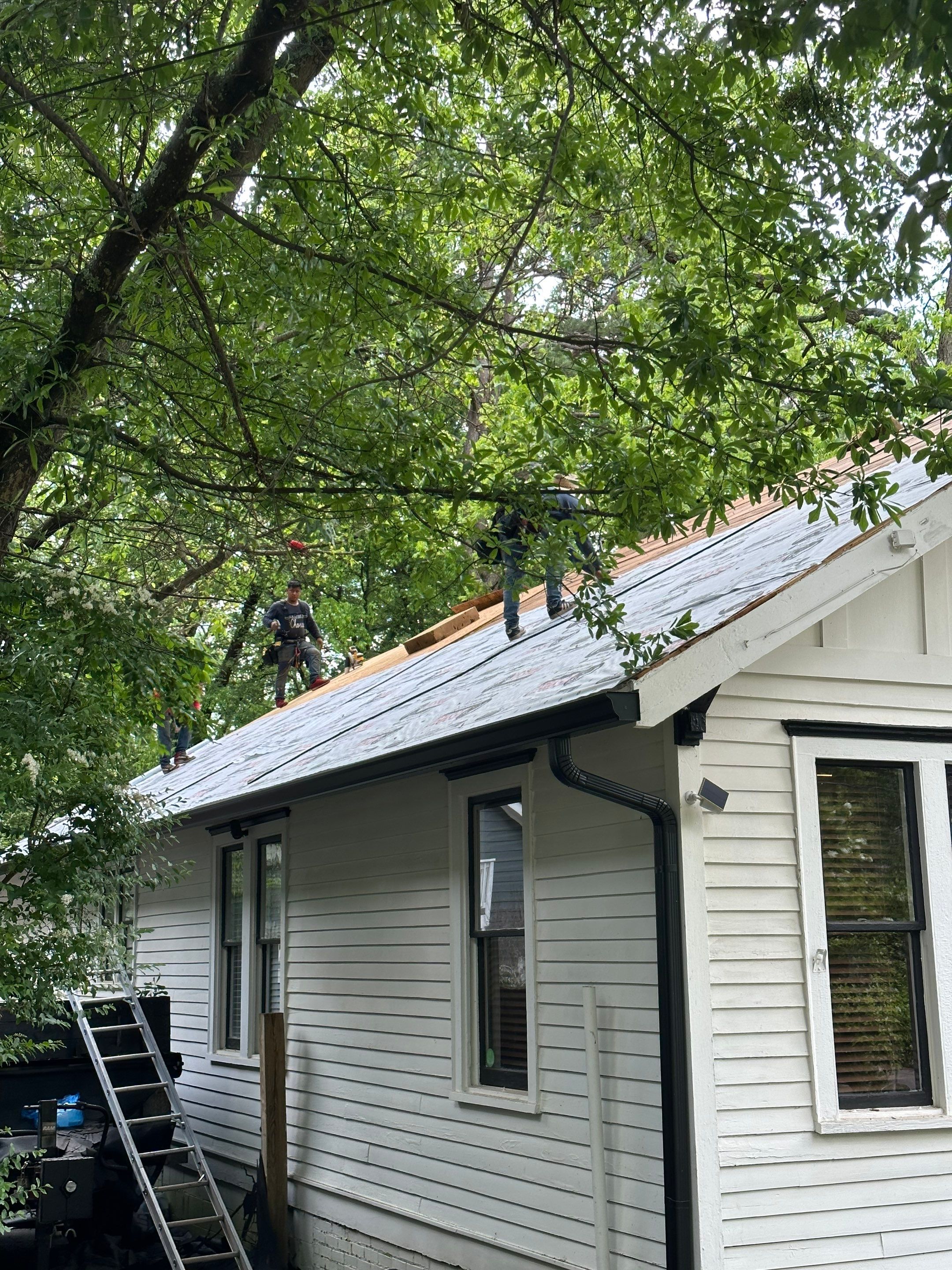 roof replacement and new black gutters by Nailed It Roofing & Remodeling LLC
