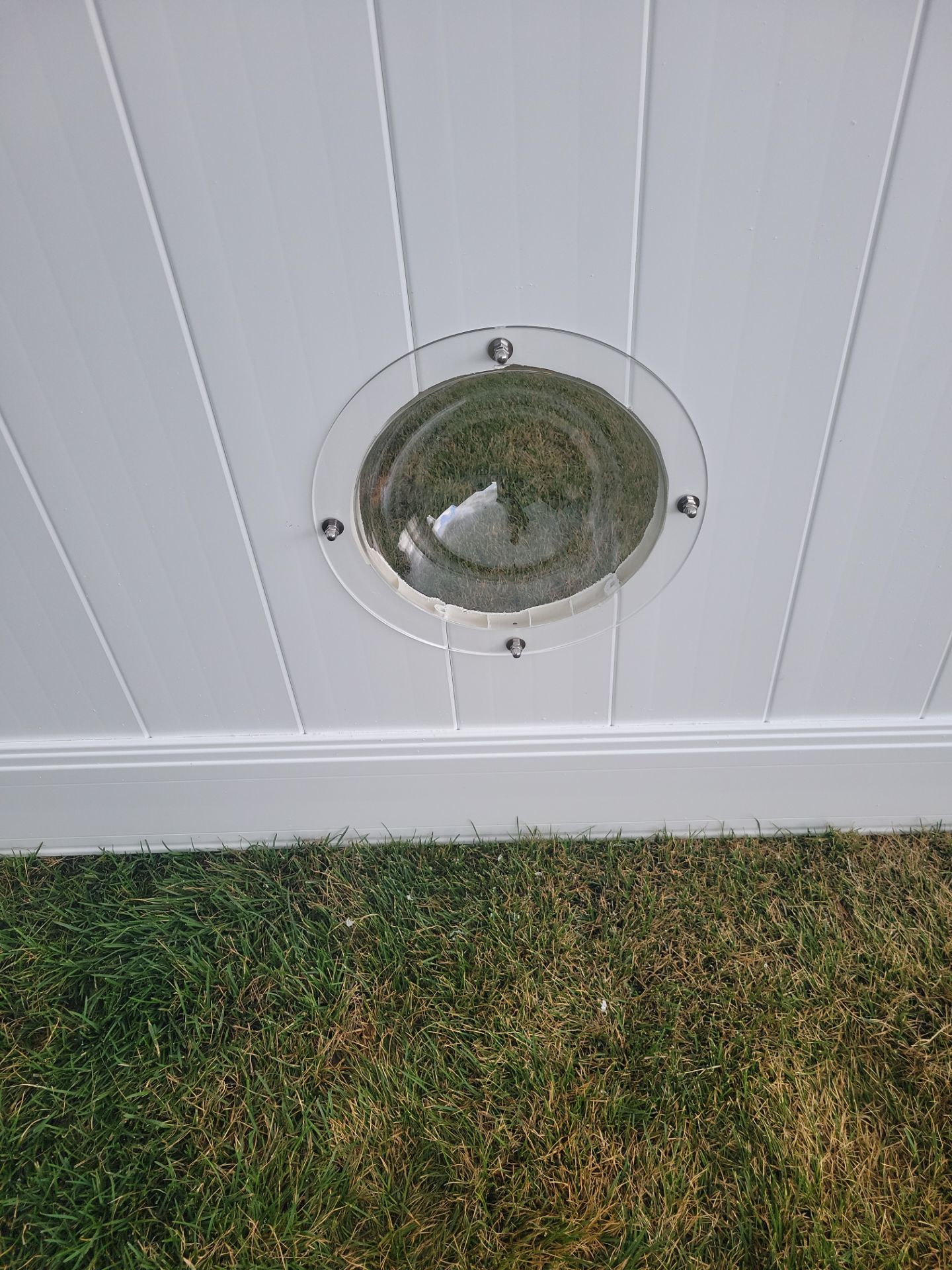 White Vinyl Privacy Fence With Pet Window in Cedar Falls by Perfect Picket Fence and Stain