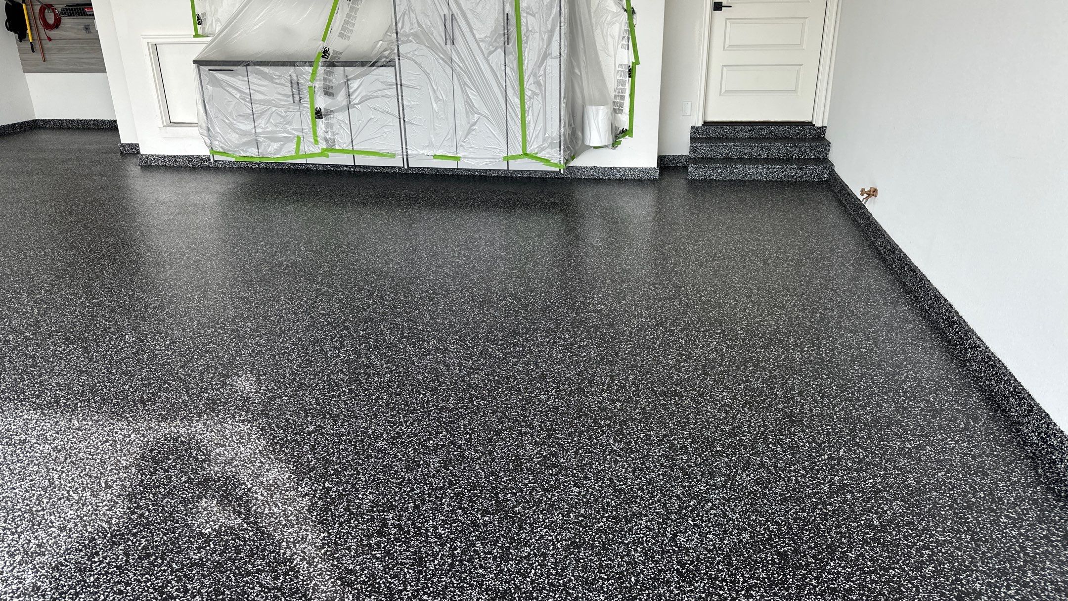 John H. received his dream garage with cabinets and a Banner Garage Floor by Banner Garage