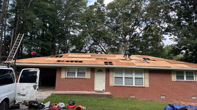 Residential Roofing Installation using Shingles 
