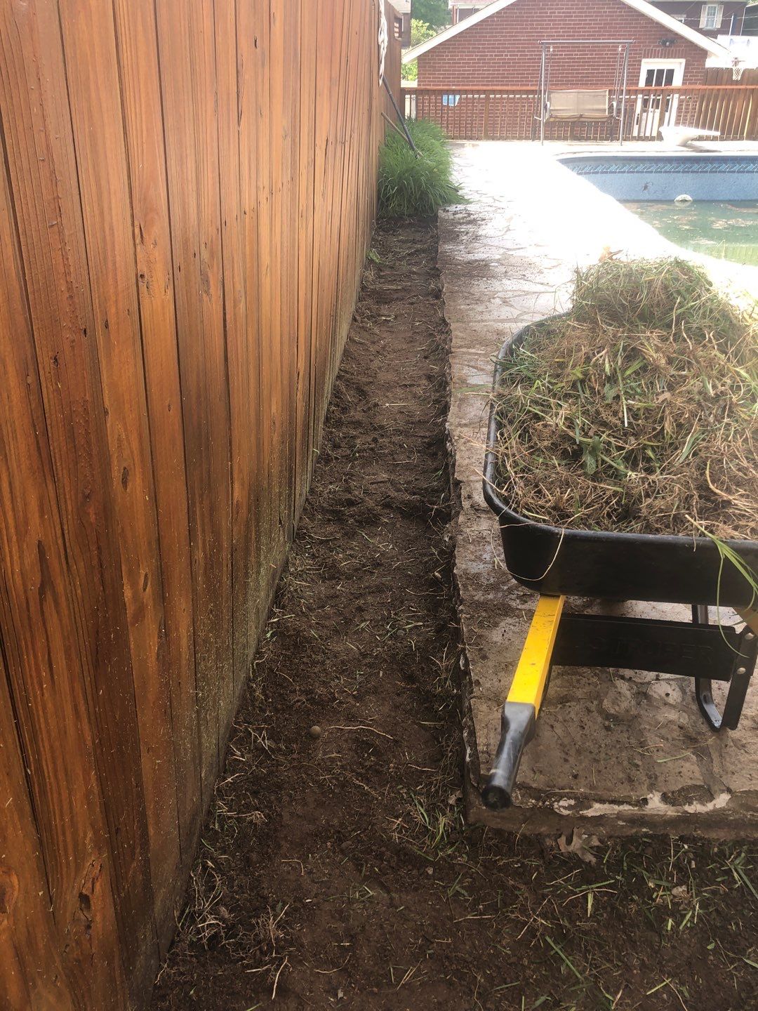 Liriope grasses, mulch and stone pavers by GrassBusters, Inc.