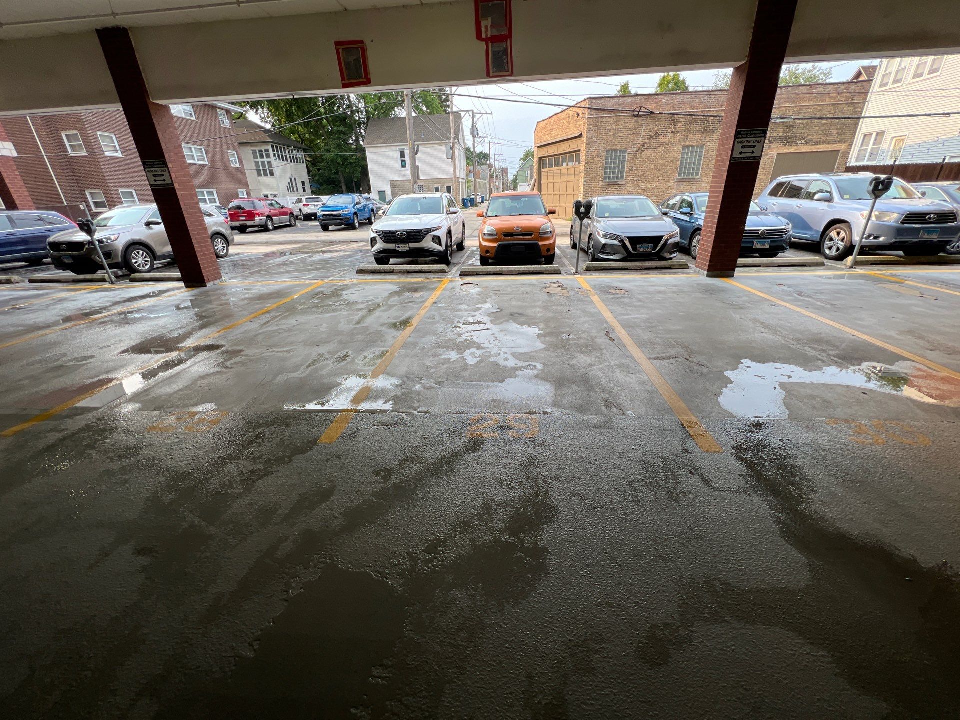 Parking garage using Hot water by Northern Power Washing LLC.