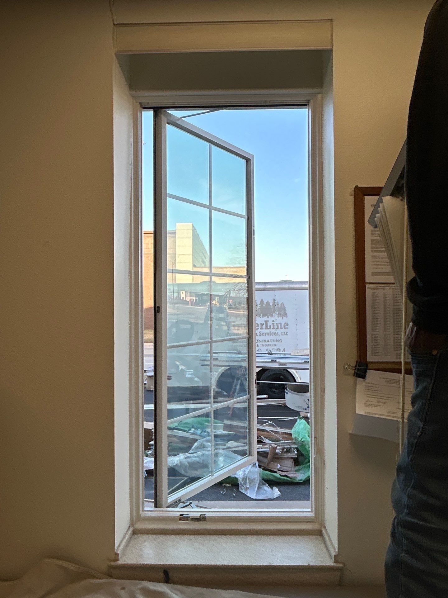 Pella Window installation using Pella Lifestyle wood/Aluminum window by United Windows and Siding LLC