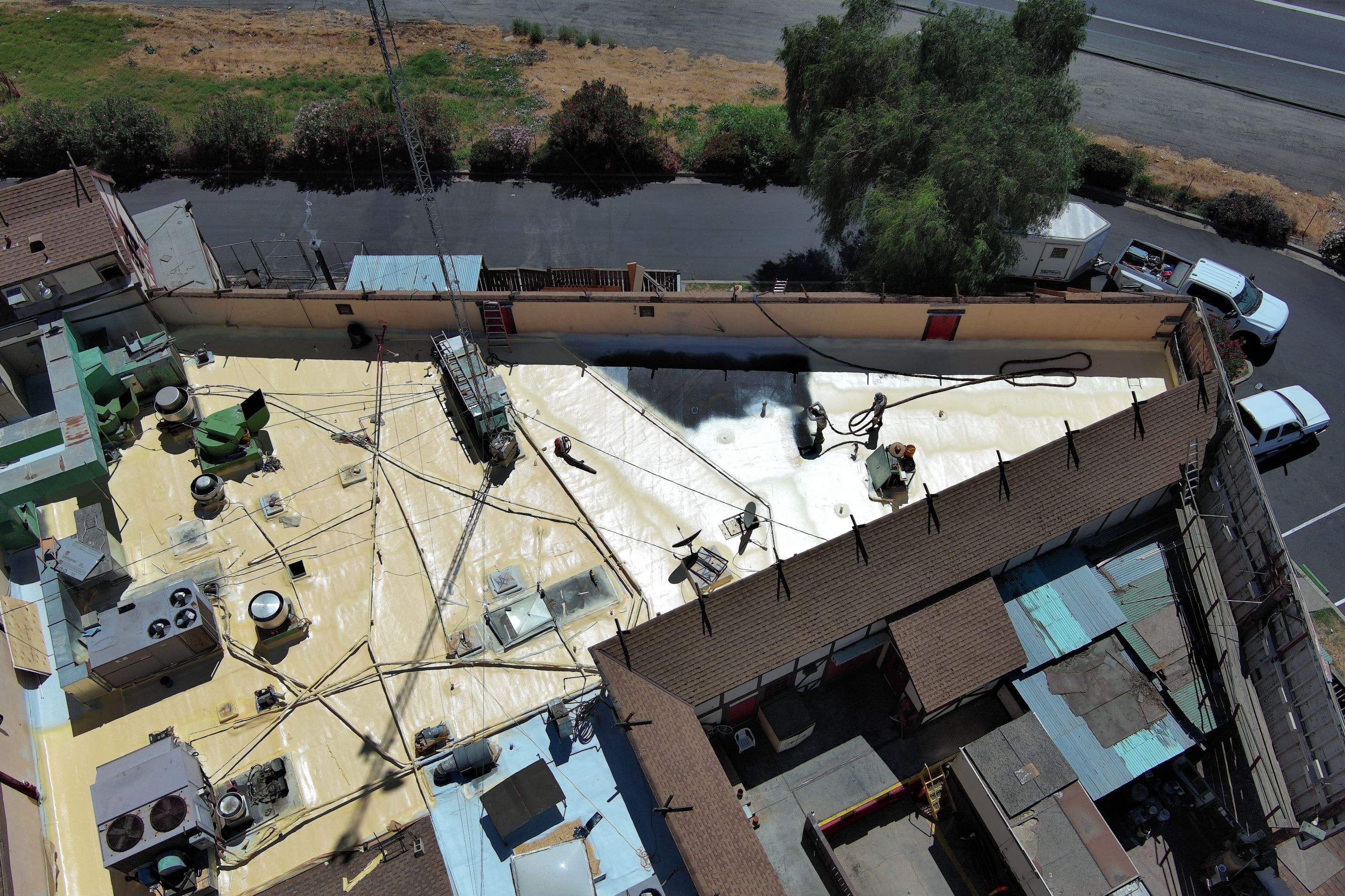 Spray foam and coatings using General Coatings acrylic coatings and spray foam by Straight Edge Roofing Inc