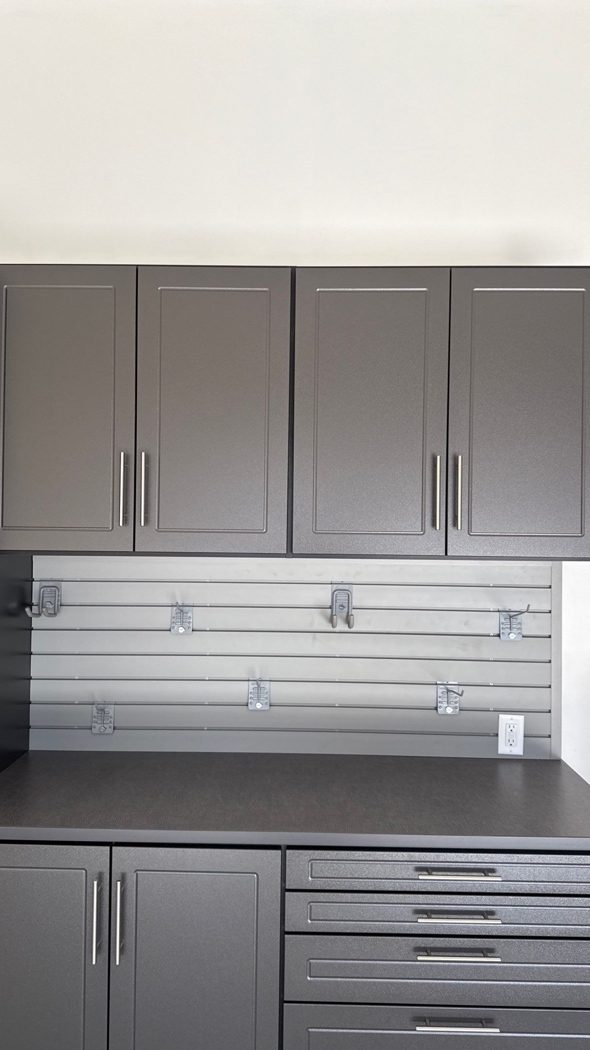 Nice Clean Look With These Pewter Cabinets by Banner Garage