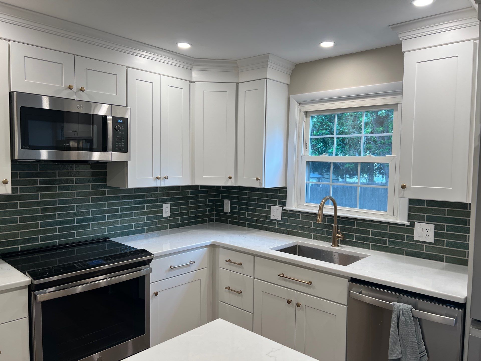 Phoenixville Kitchen Remodel with White Shaker Cabinets and Green Backsplash by Reliable General Contracting