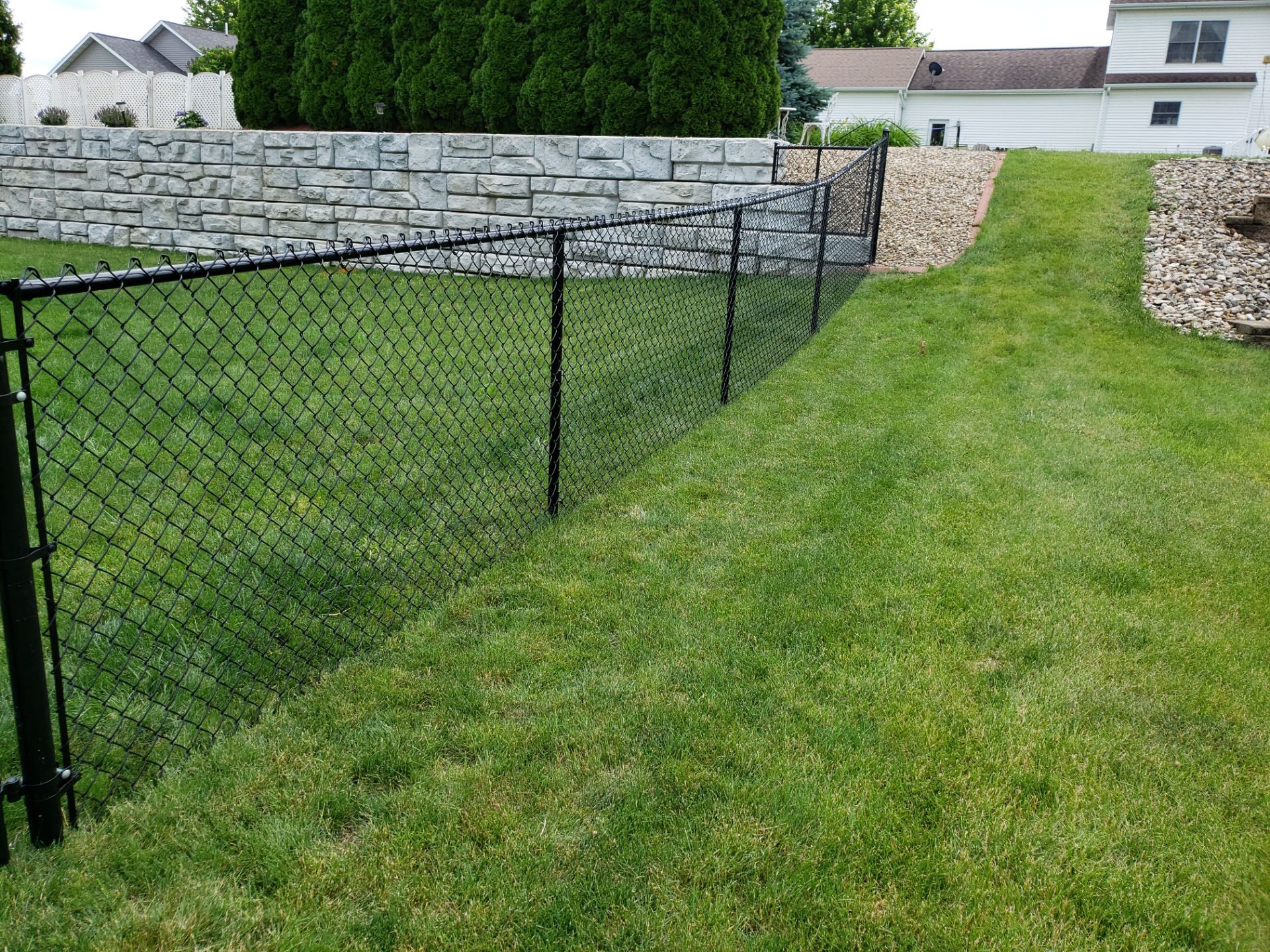 Black Vinyl-Coated Chain Link Fence Installation in Denver by Perfect Picket Fence and Stain