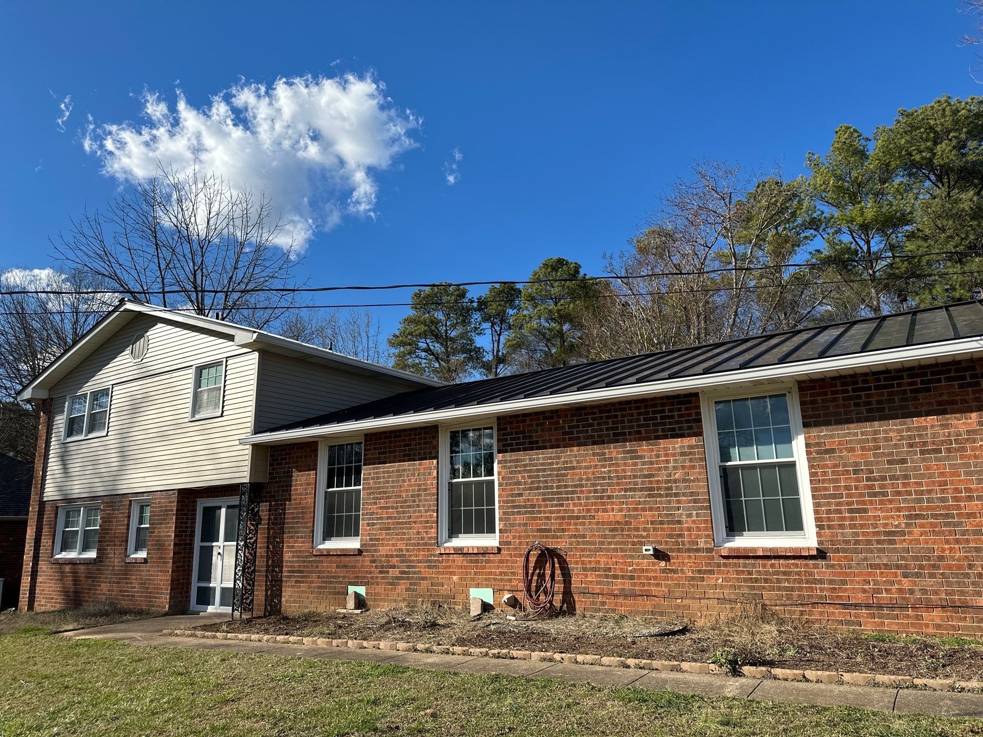 Residential Roofing Installation using Standing Seam Metal by Undersun Roofing 