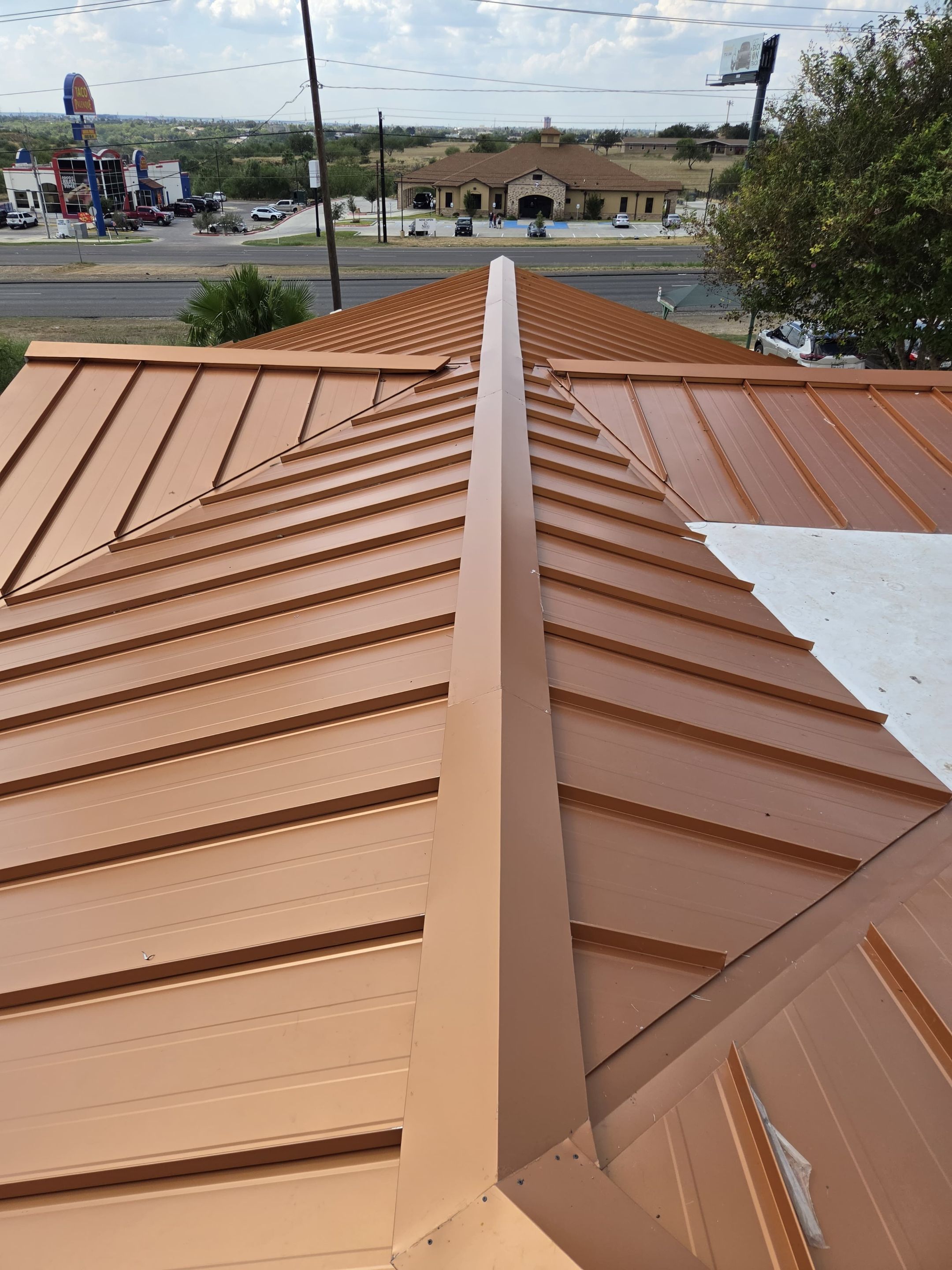 Copper Standing Seam Metal Roof Installation for Laredo Medical Clinic by JM Flores Roofing & Construction, Inc