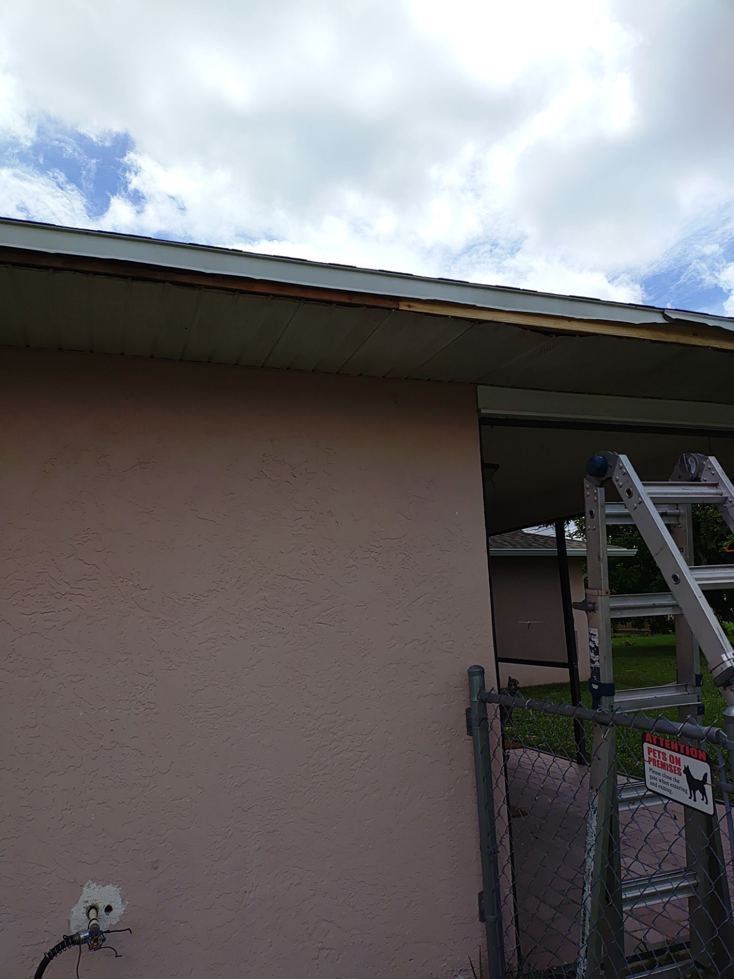 Replace gutter using White Down Spouts in Cape Coral FL by Gutter Professors