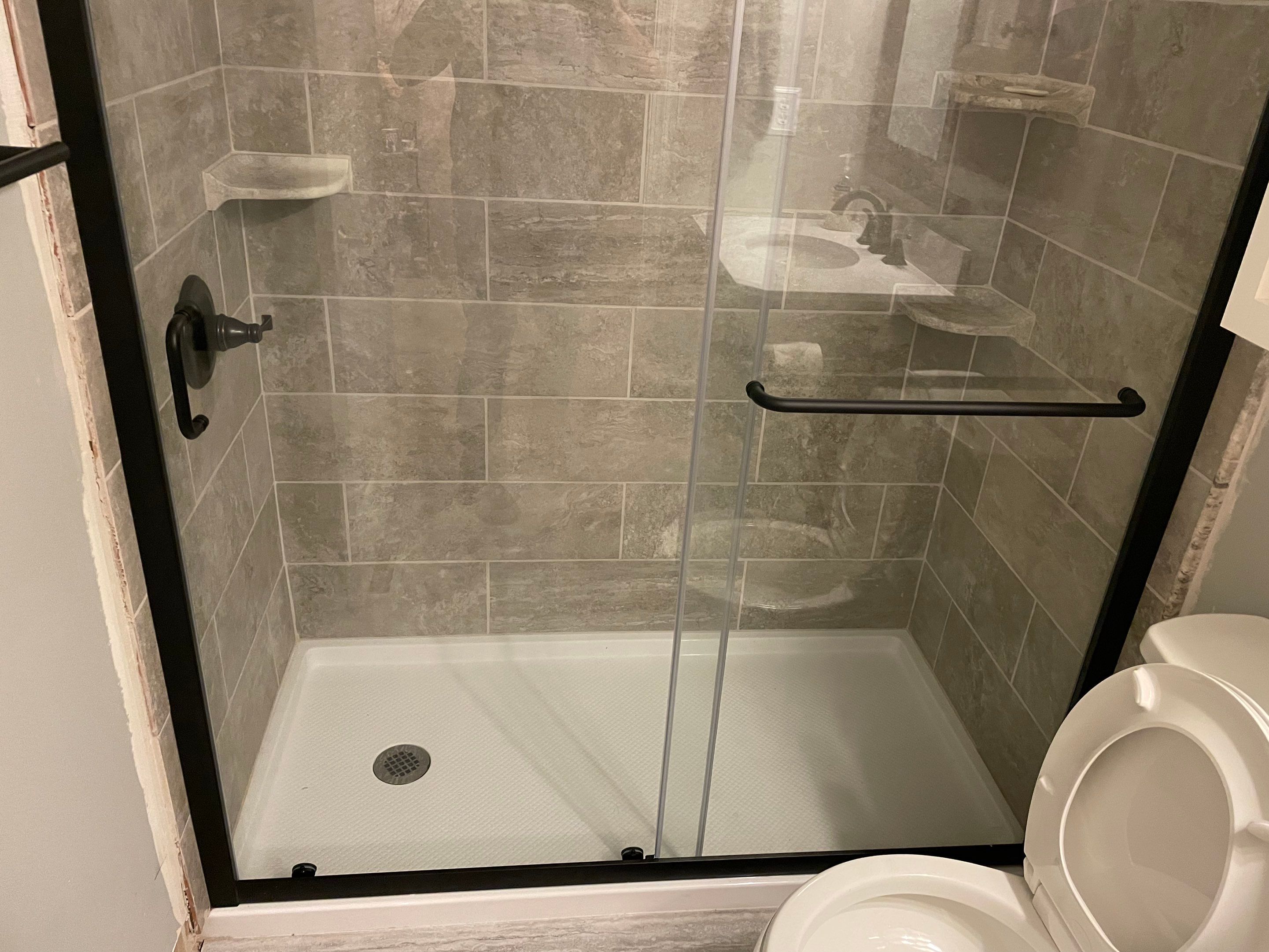 Bathroom Remodel using Tile by Home Concepts Construction