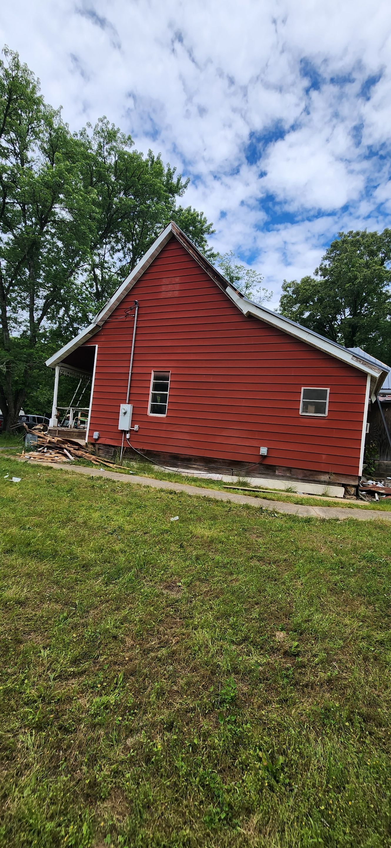 Residential Roofing Installation using 26 Gauge Colored Panels by Hostetler Roofing