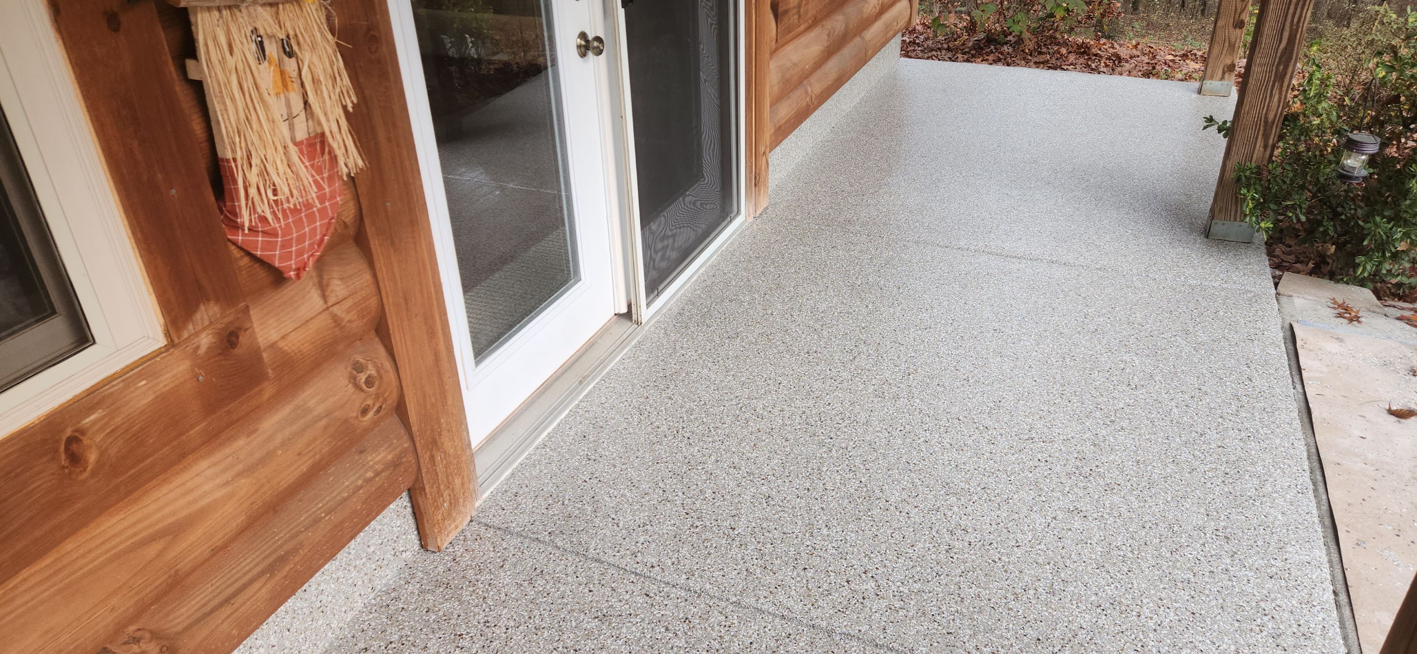 Front Porch and Garage using Creekbed by Elite Floor Solutions