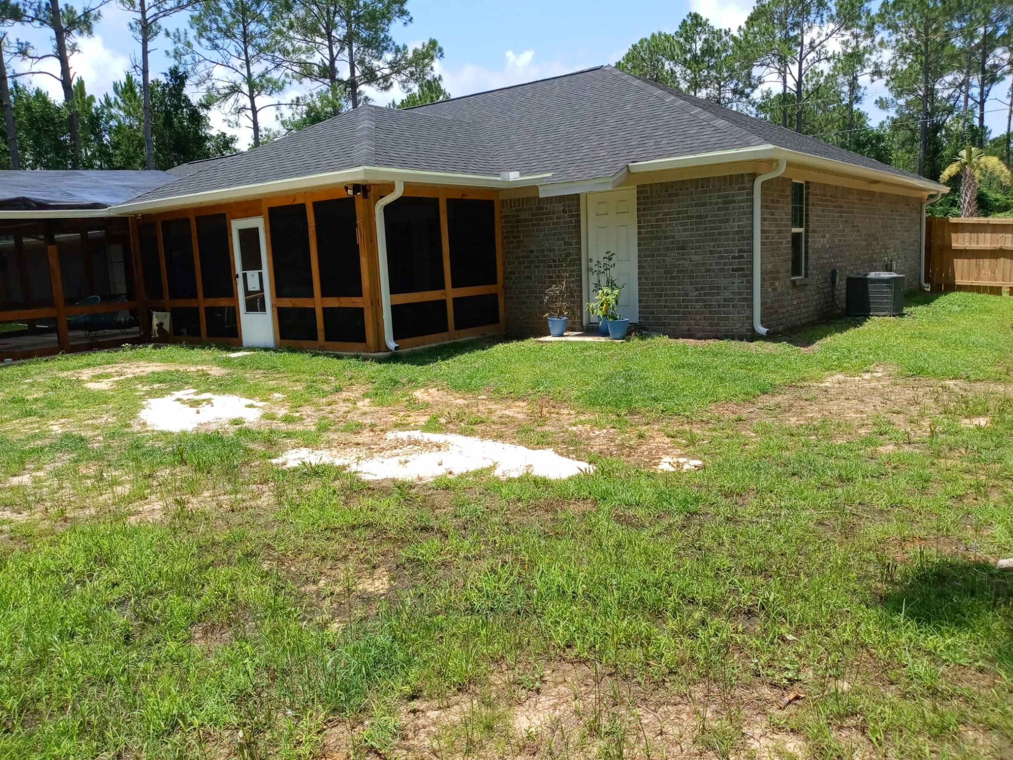 Downspout Installation using White Down Spouts in Milton FL by Gutter Professors