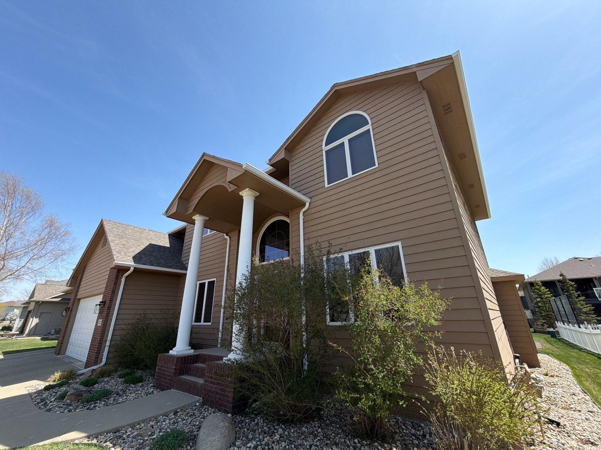 Full Exterior House Painting and Deck Staining in Sioux Falls by Select Painting, Coatings & Garage Cabinets