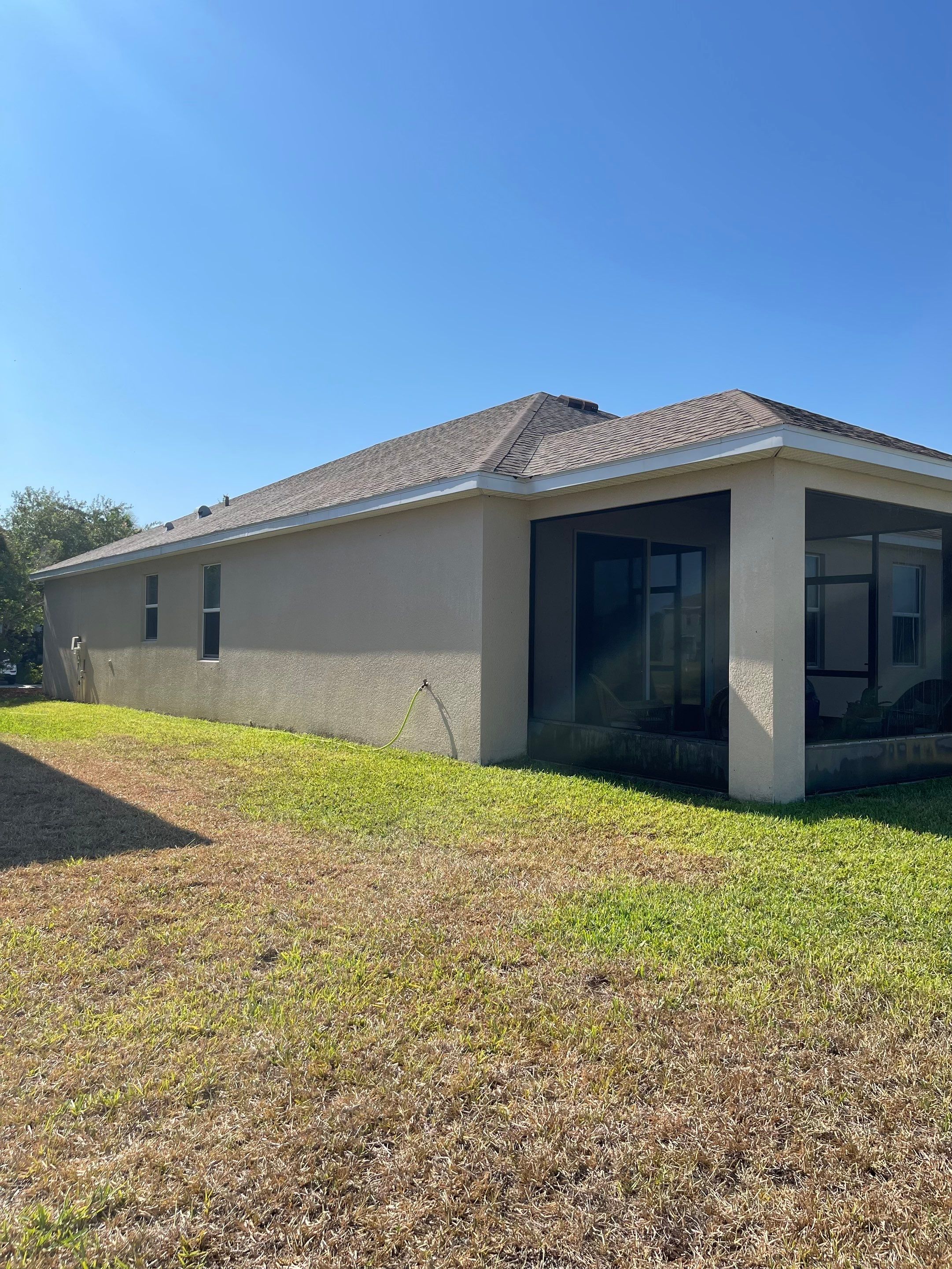 Asphalt Shingle Roof Soft Wash Cleaning & Concrete Pressure Washing in CopperStone Community, Parrish, FL by Sunshine AquaWash