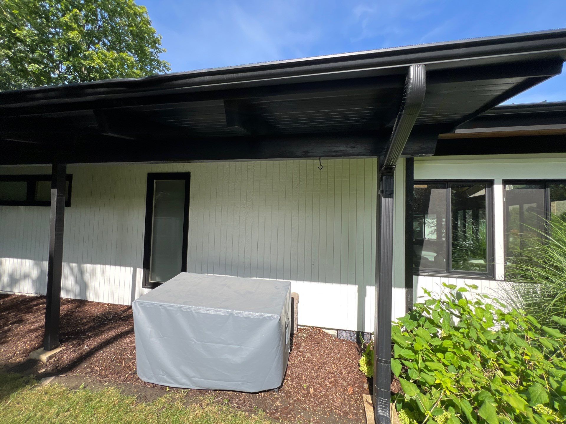 Complete Exterior House, Bluestone & Garage Floor Cleaning by Northern Power Washing LLC.