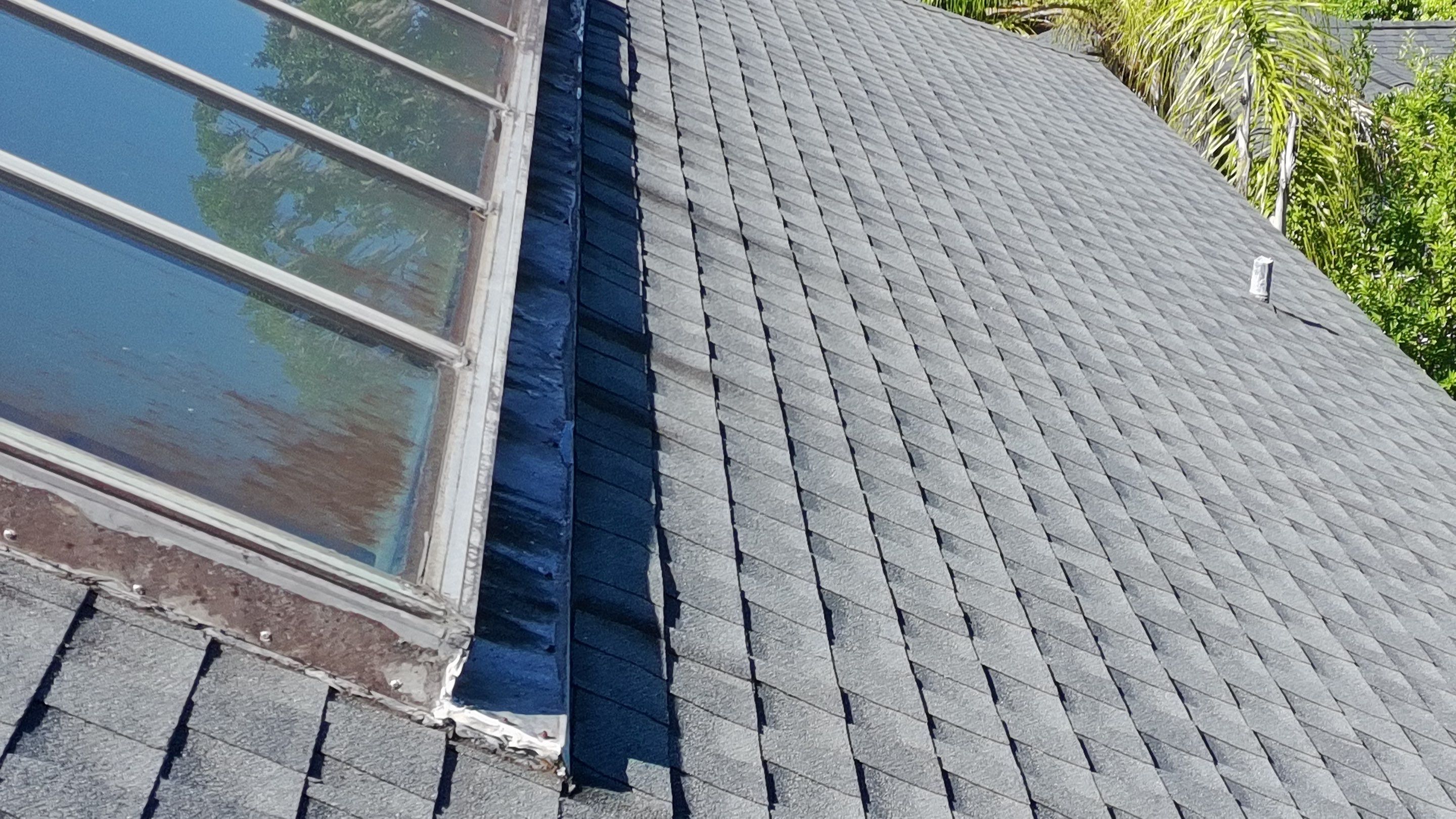 Ridge Skylight Repair and Shingle Roof Maintenance in Winter Park by Fortified Roofing Solutions Corp.