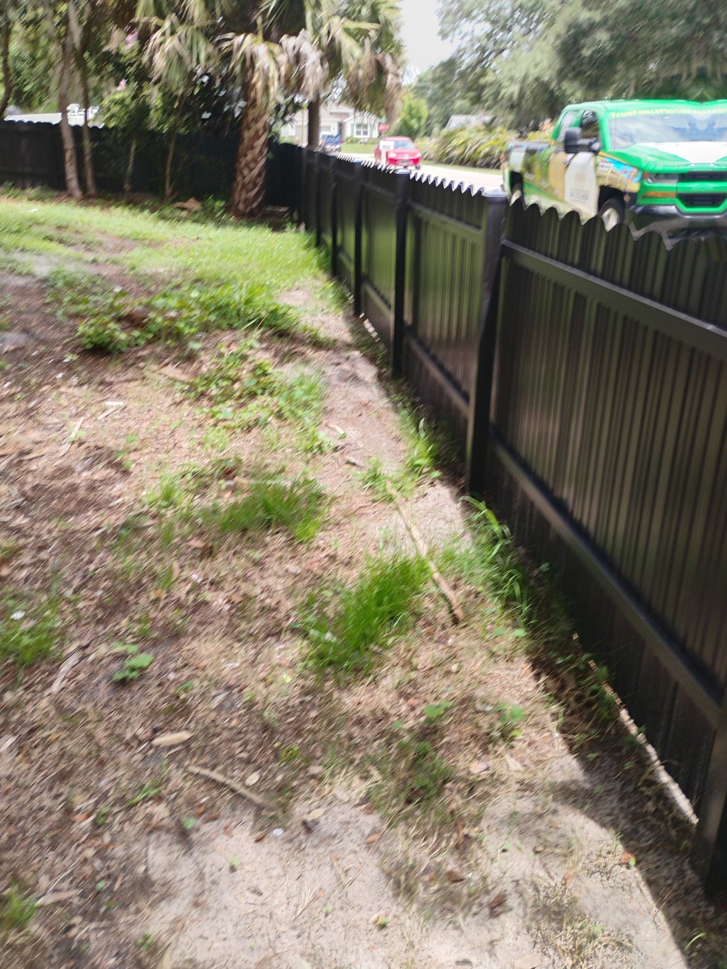Bronze Scalloped Metal Privacy Fence Installation in North Port by True Fence LLC