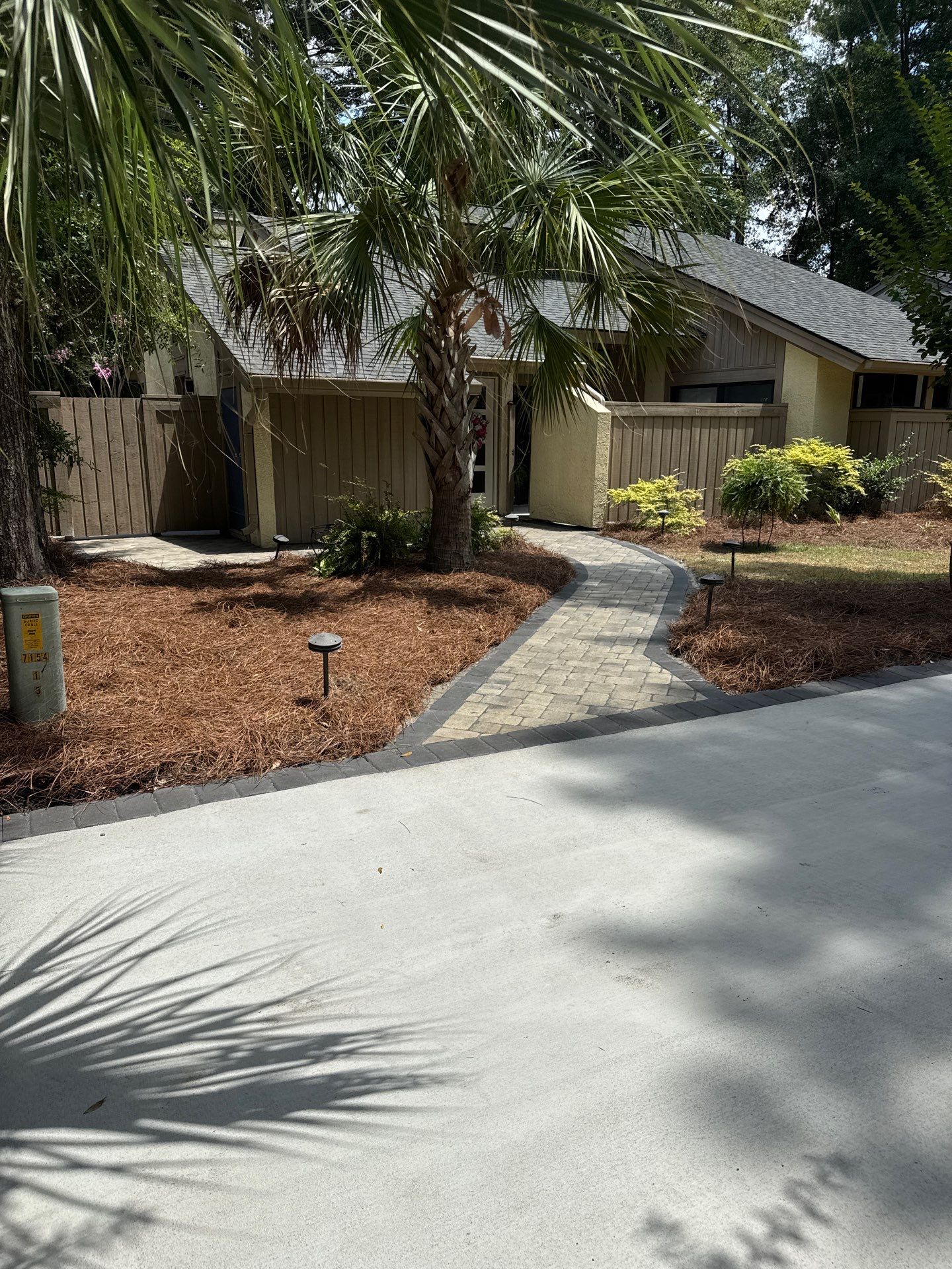 Custom Concrete Patio and Herringbone Paver Walkway in Hilton Head Island by Lowcountry Scapes, LLC