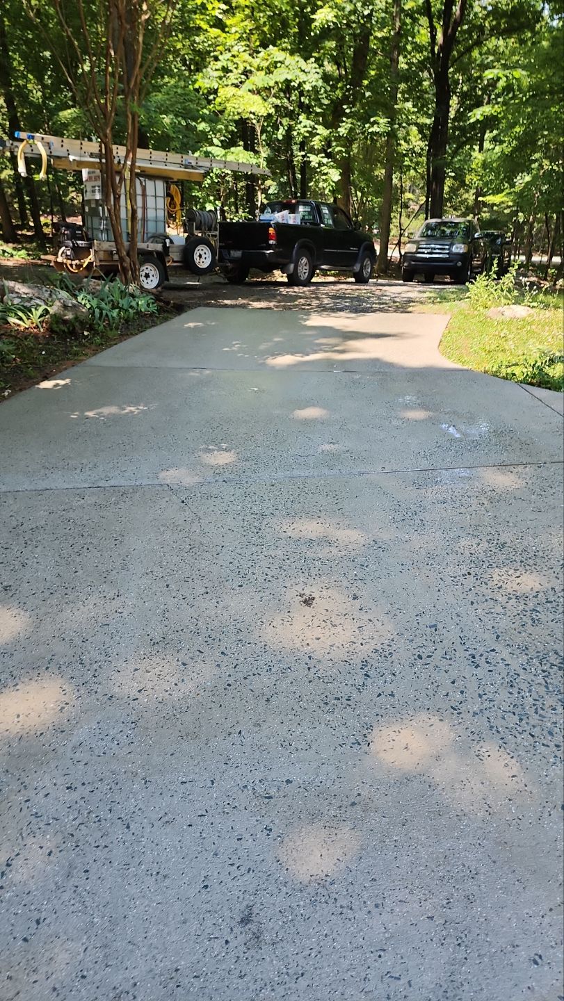 Driveway Clean using cleaner by Power Wash Masters LLC