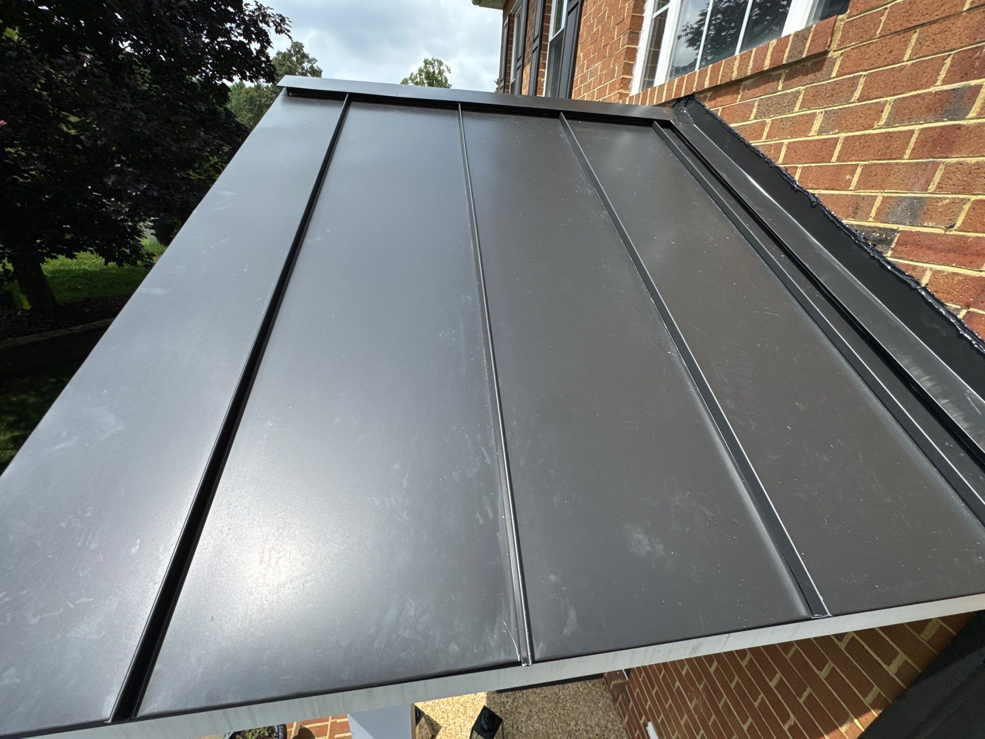 Standing Seam Metal Porch Roof Installation in Mechanicsville, VA by Cade Construction
