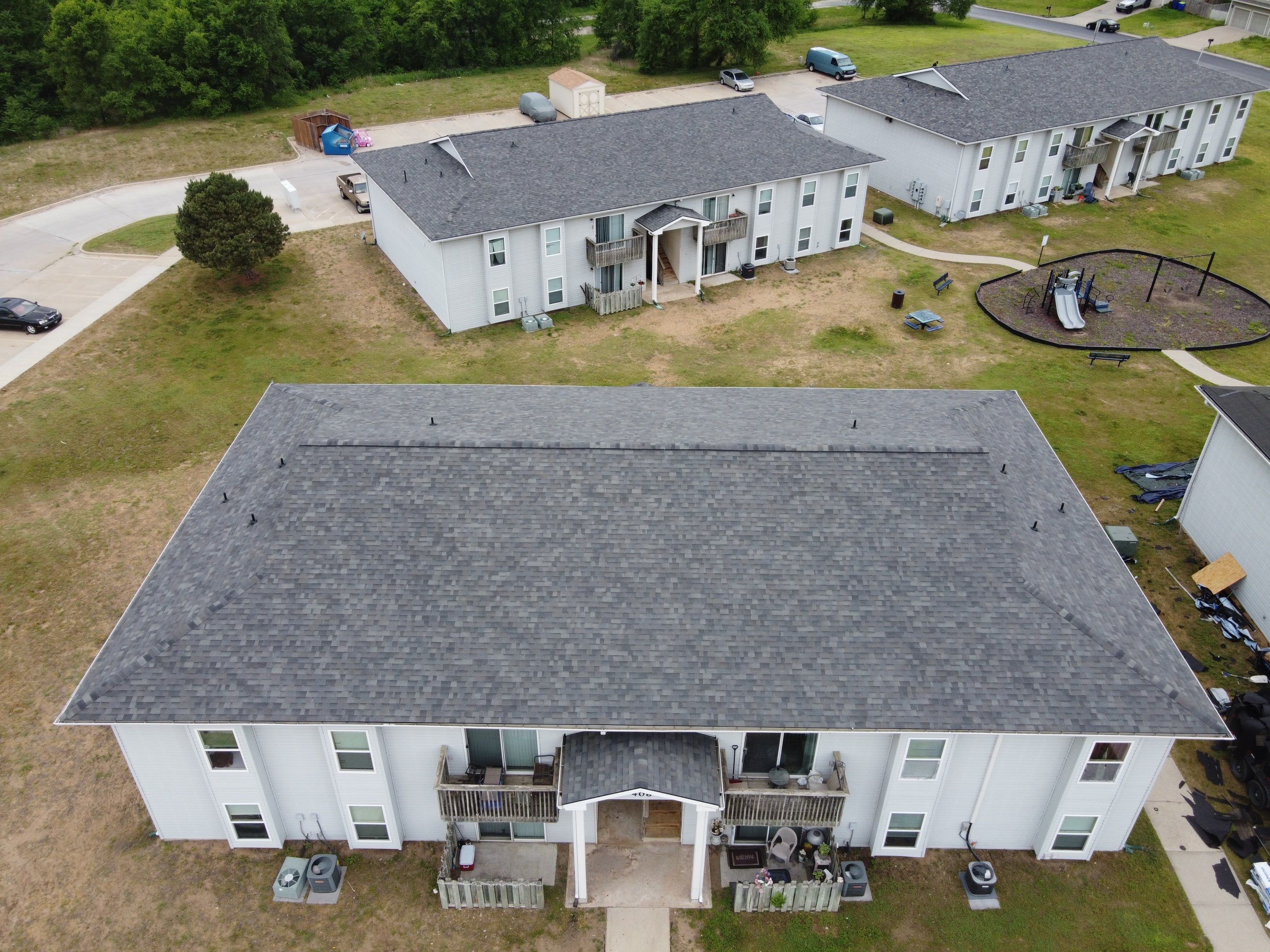 Multifamliy Complex ROOF REPLACEMNT with Ventilation Upgrades using Malarkey Vista Class III IR Shingles by Gorilla Exteriors Contracting, LLC