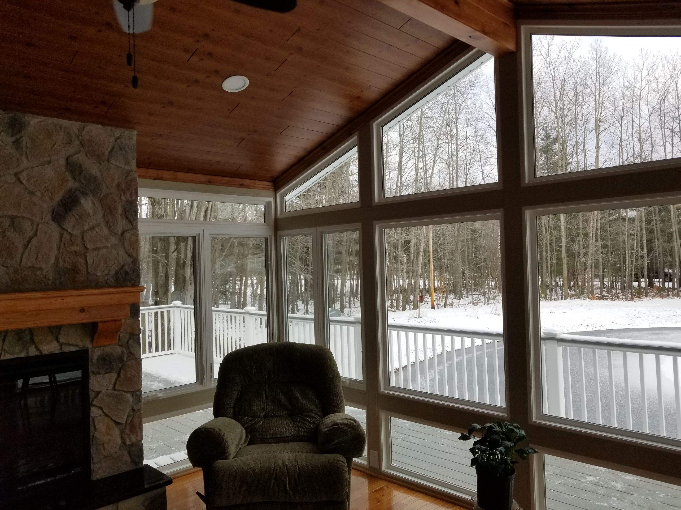 Sunroom and deck addition. by Energy Plus Home Improvements