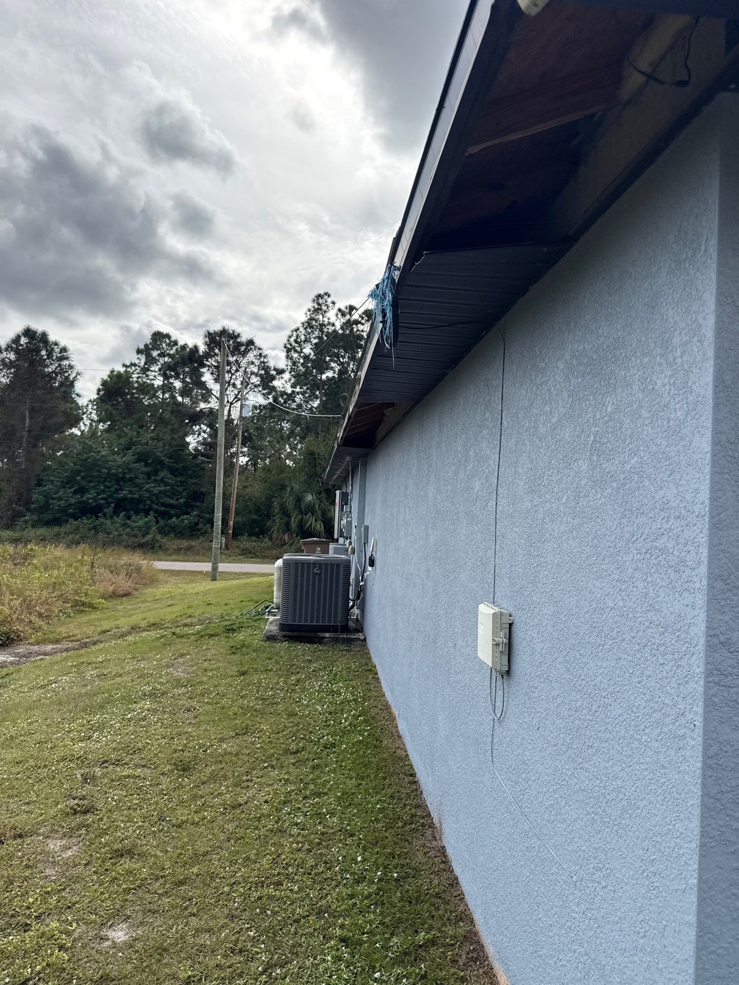 Black Seamless Gutters & Soffit/Fascia in Lehigh Acres FL by Gutter Professors