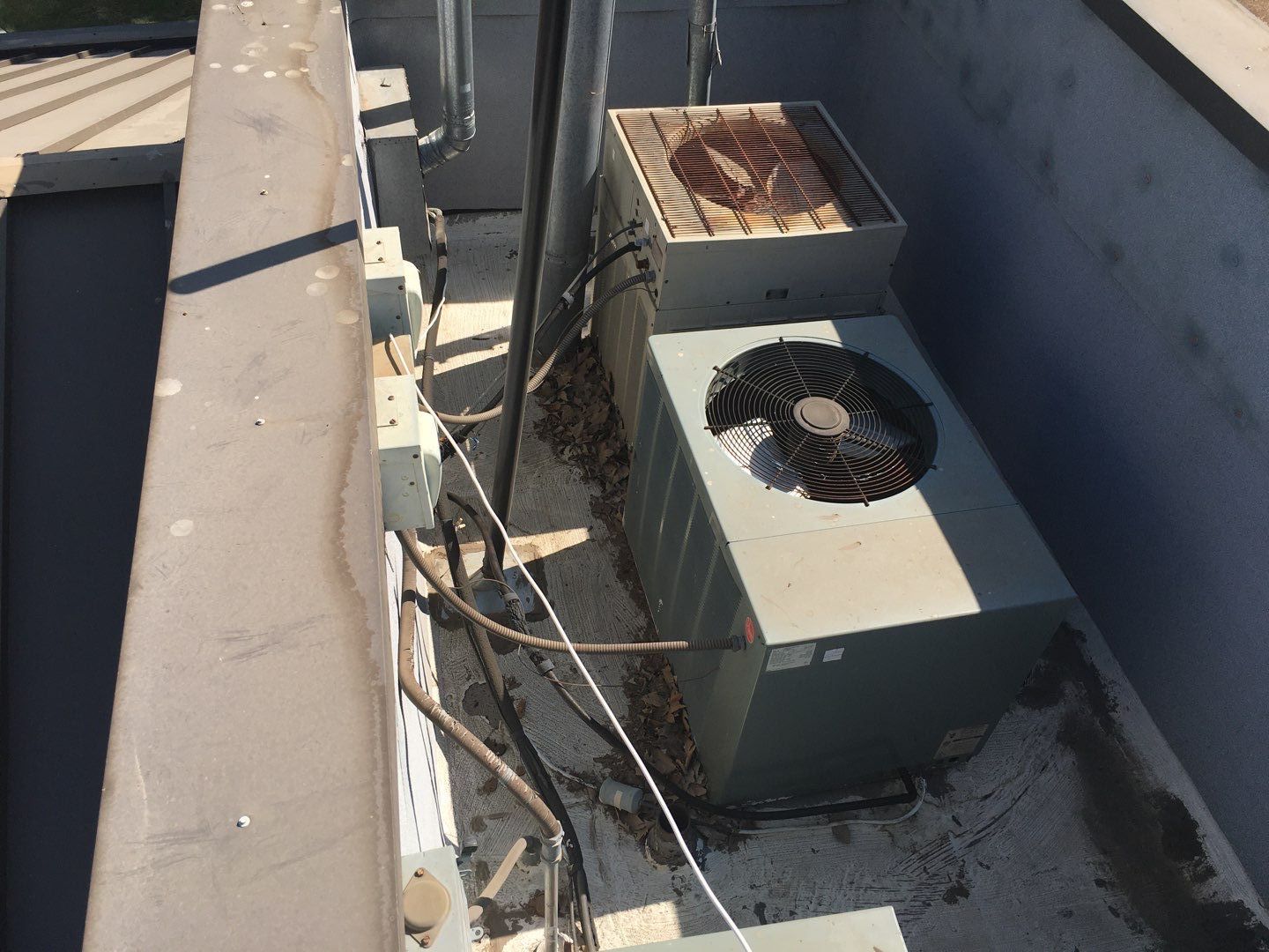 Spray foam and coatings inside commercial building HVAC well using Spray foam and coatings over existing BUR system by Straight Edge Roofing Inc