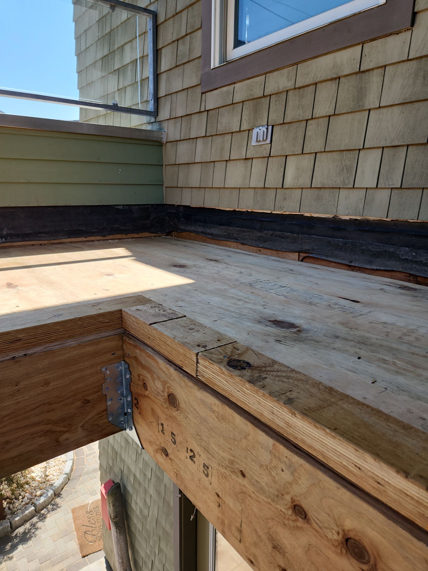 Deck Installation using Tanzite Stone Decking by A Plus Exterior