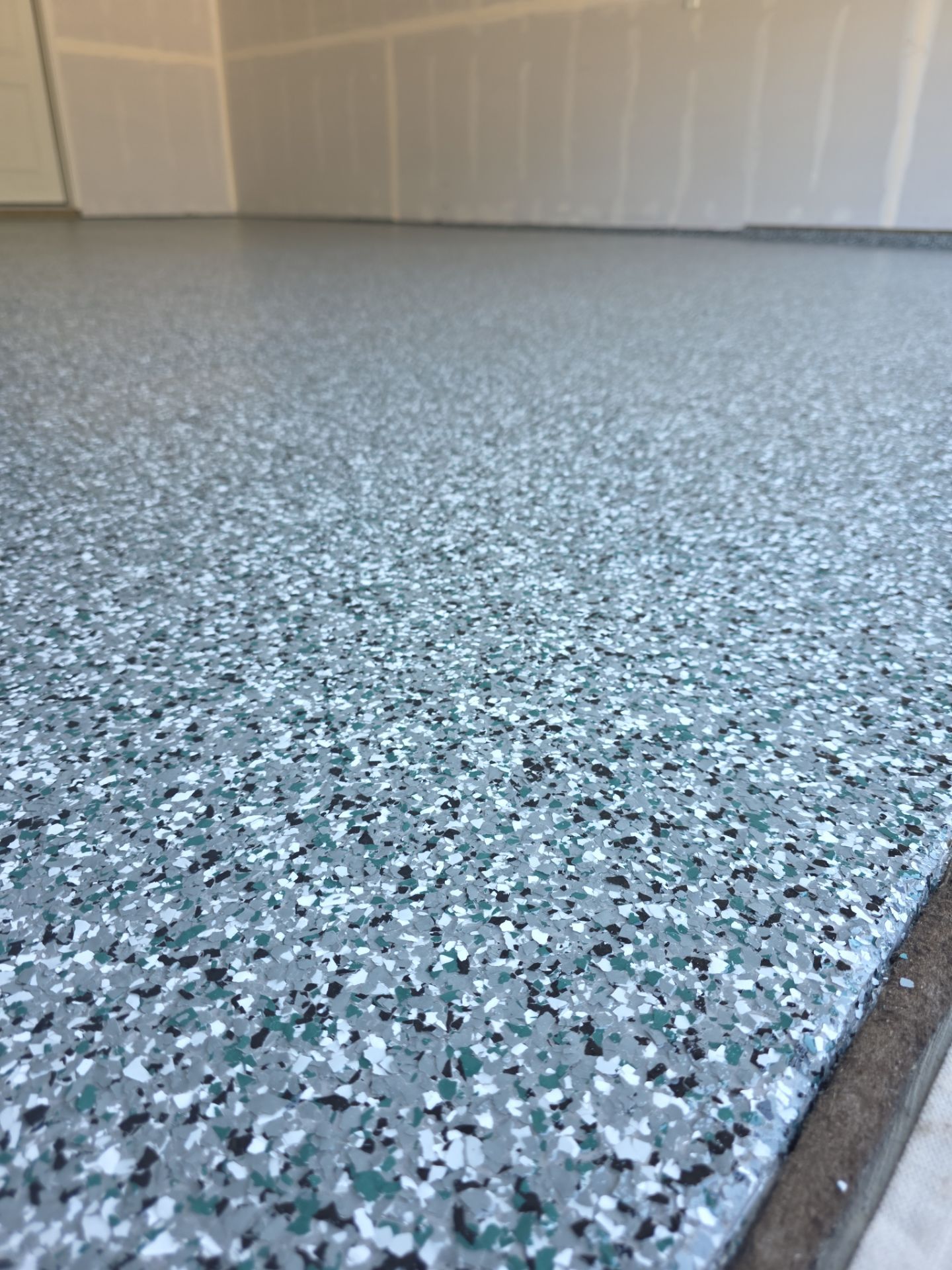 Residential Garage and Entryway Epoxy Floor Transformation in Spokane by Croc Coatings, LLC
