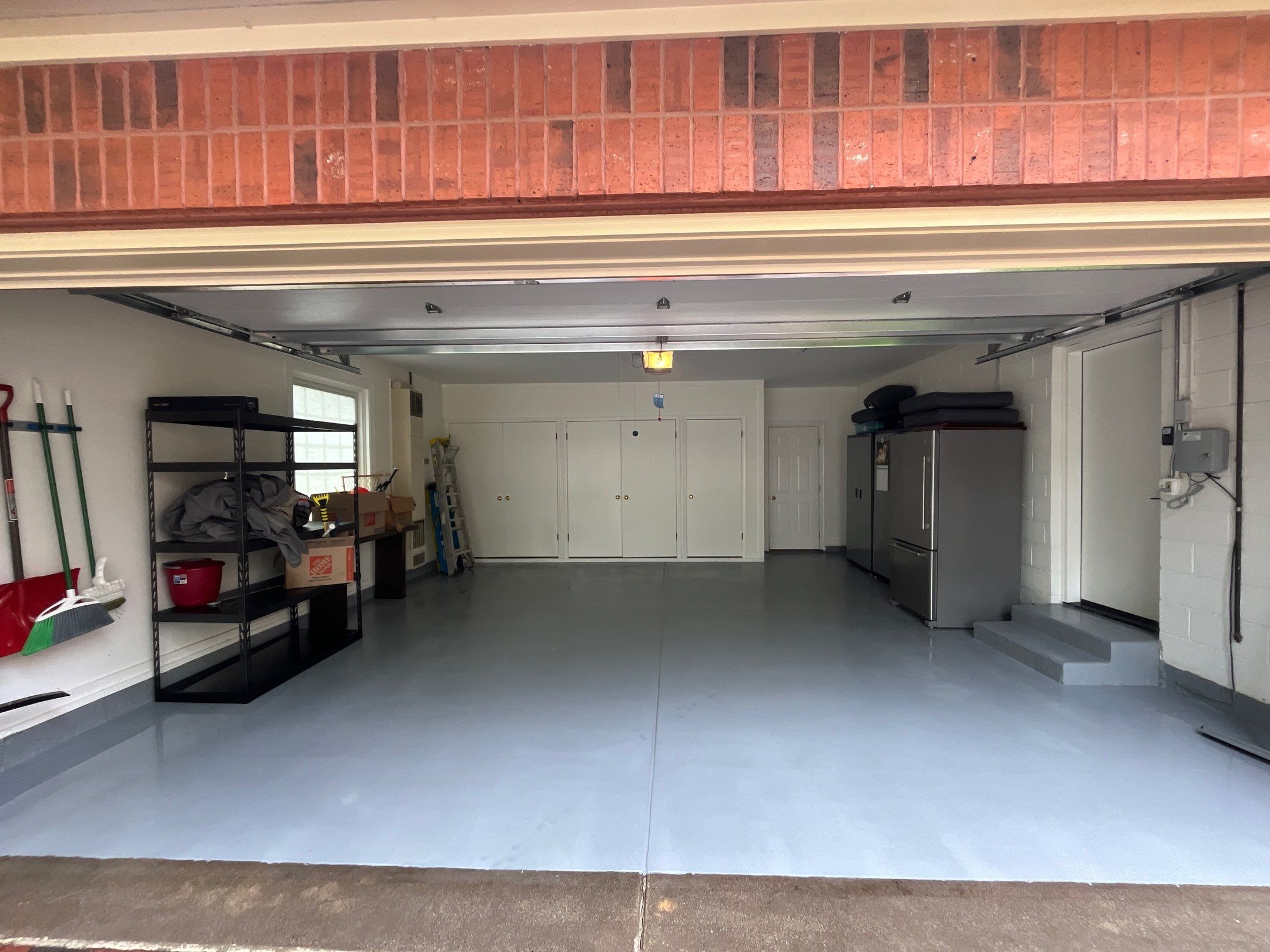 epoxy garage floor cleaning using degreaser by Northern Power Washing LLC.
