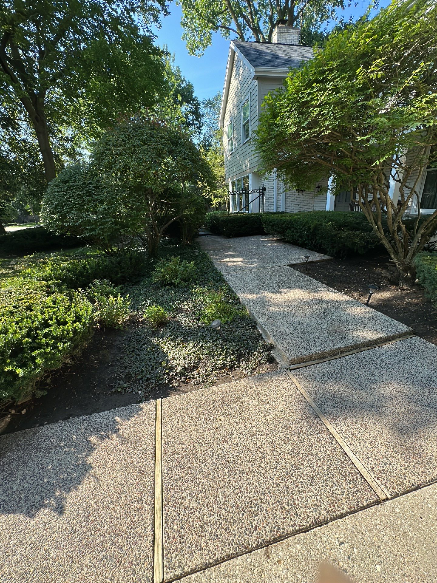 Aggregate concrete cleaning and sealing using Surebond SB-9000 by Northern Power Washing LLC.