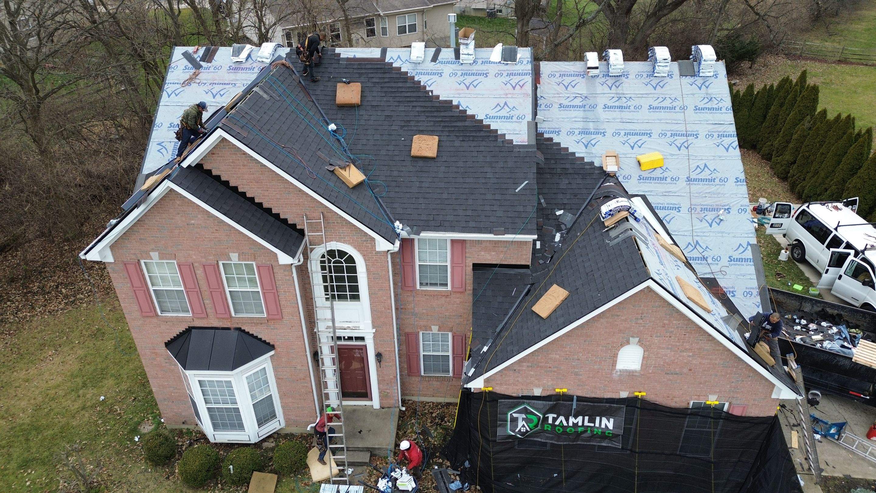 Walden Ponds - Pristine Black and Hydro Flo Gutter Guards by Tamlin Roofing
