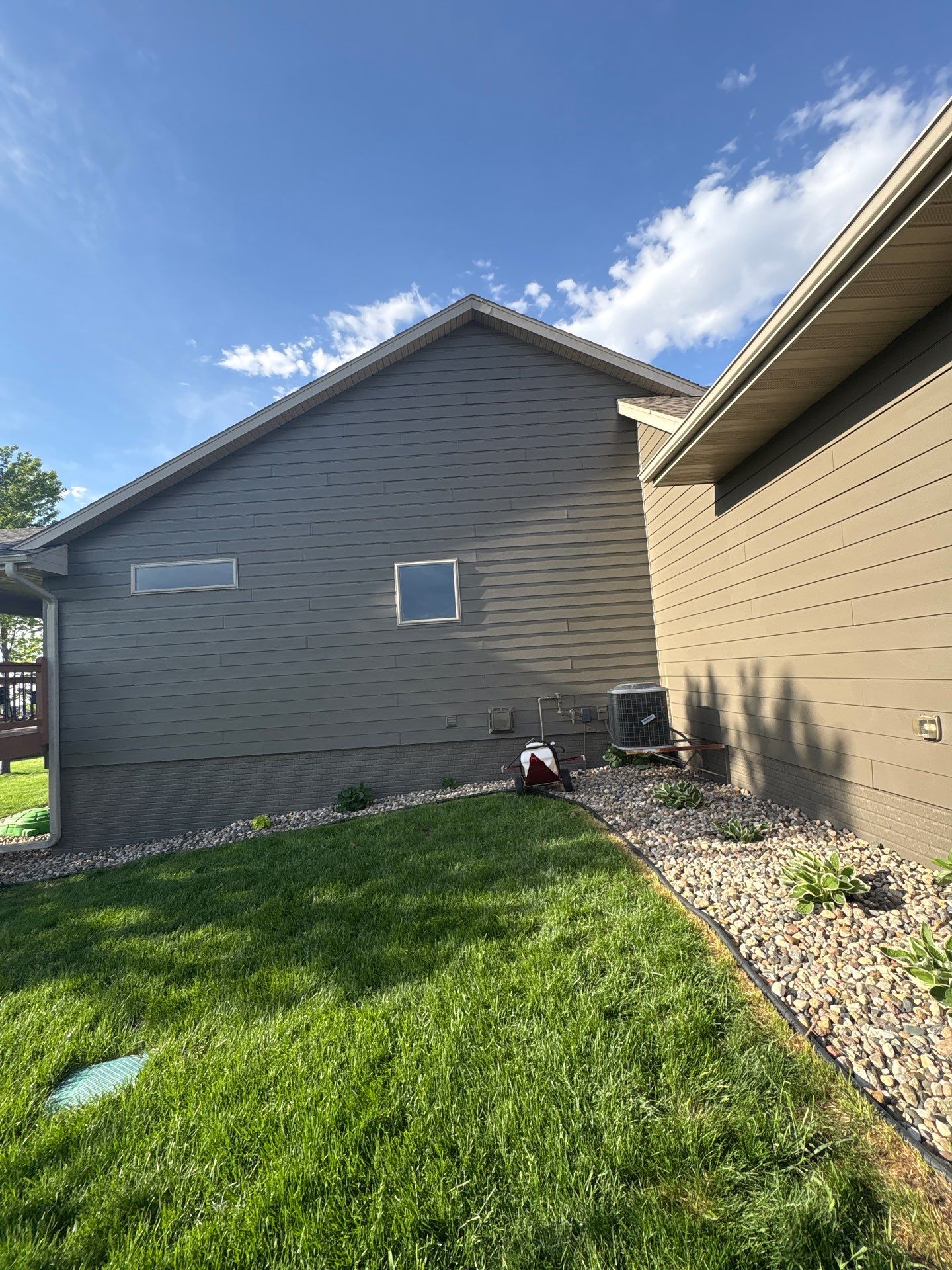 Sioux Falls Residential Exterior Refresh with Fiber Cement Siding by Select Painting, Coatings & Garage Cabinets