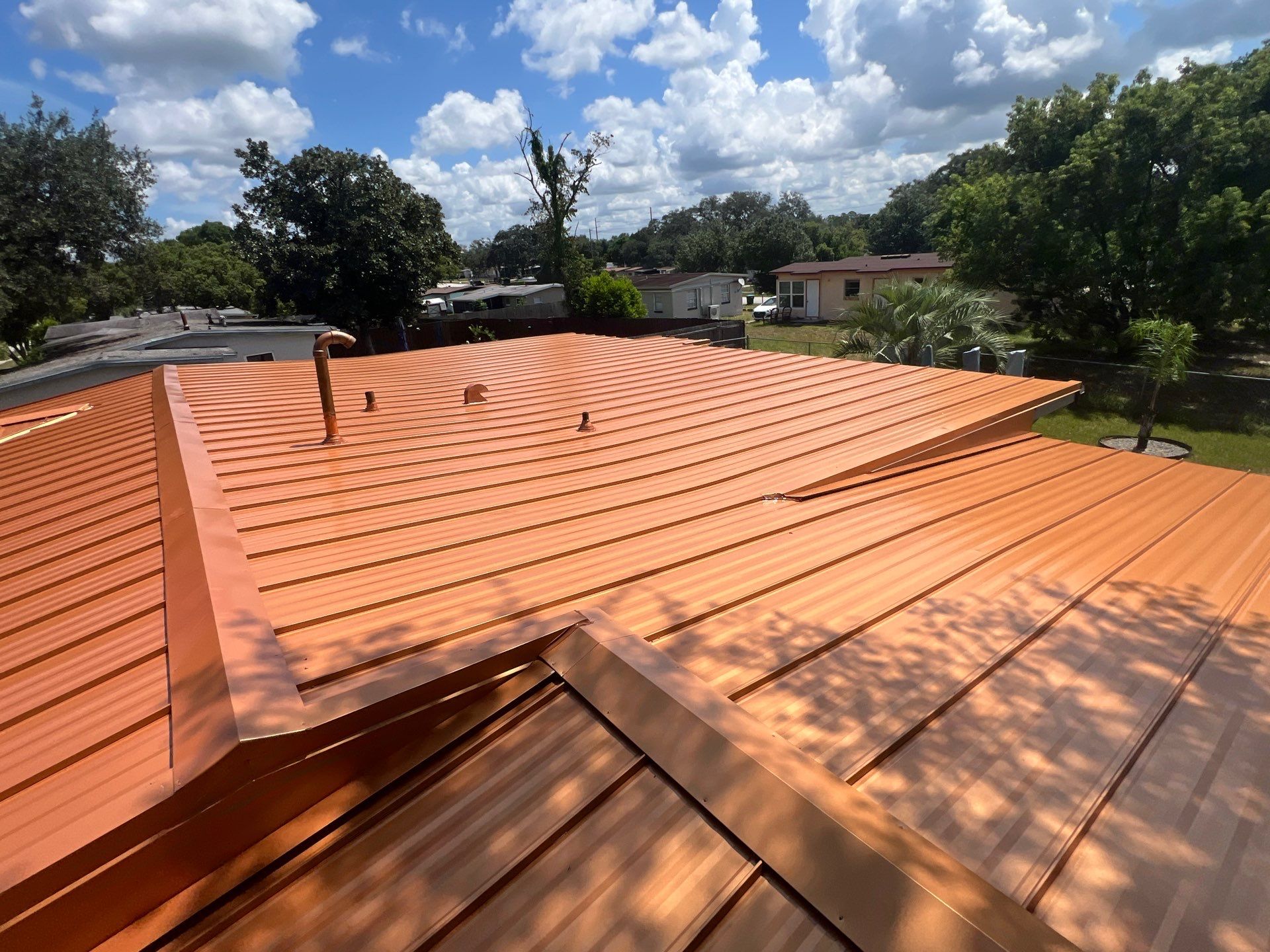 Standing Seam Metallic Copper Metal Roof Replacement in Deltona by Pinnacle Roofing Group