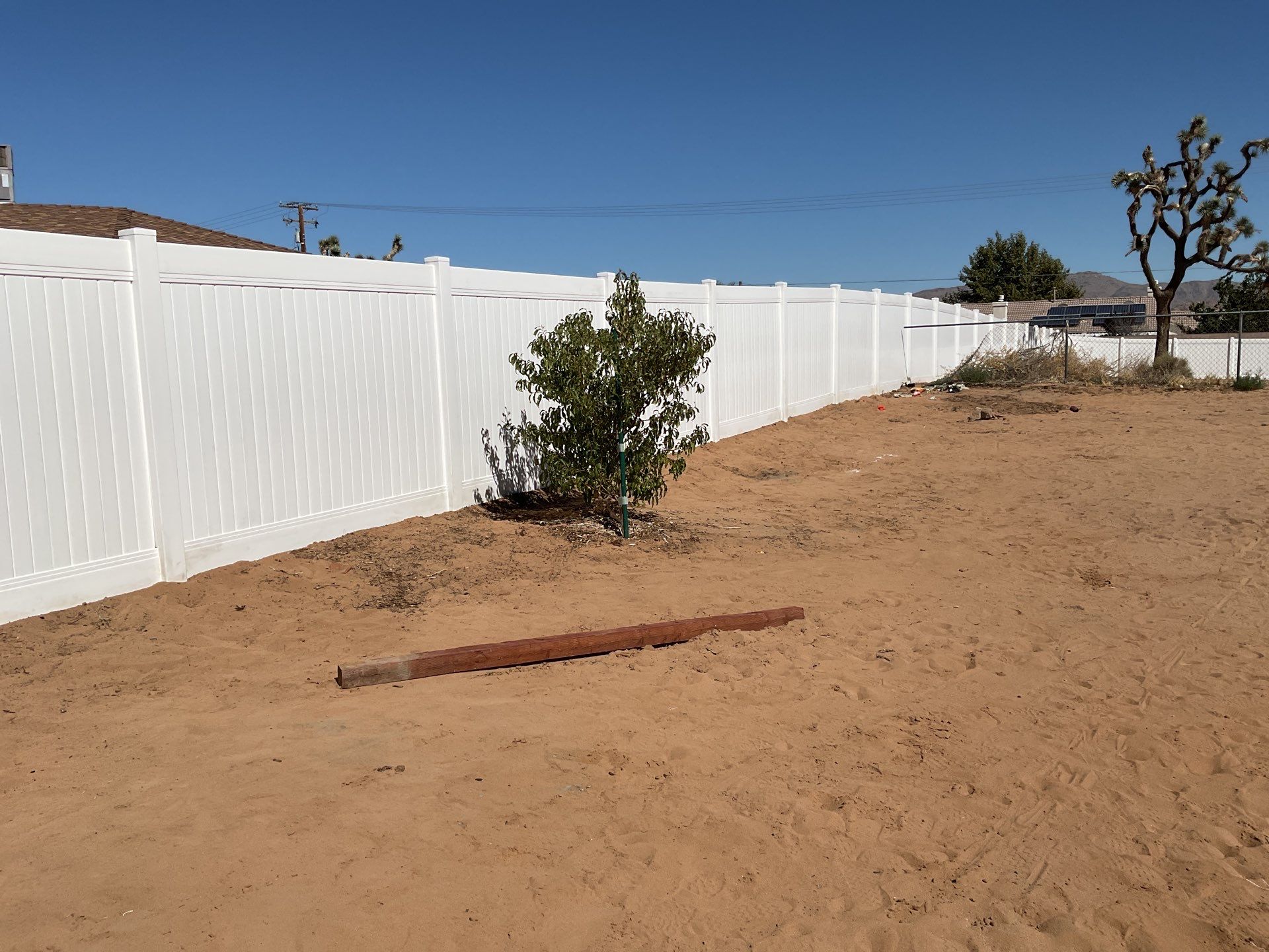 White picket fence  by Fence Guys Inc. 