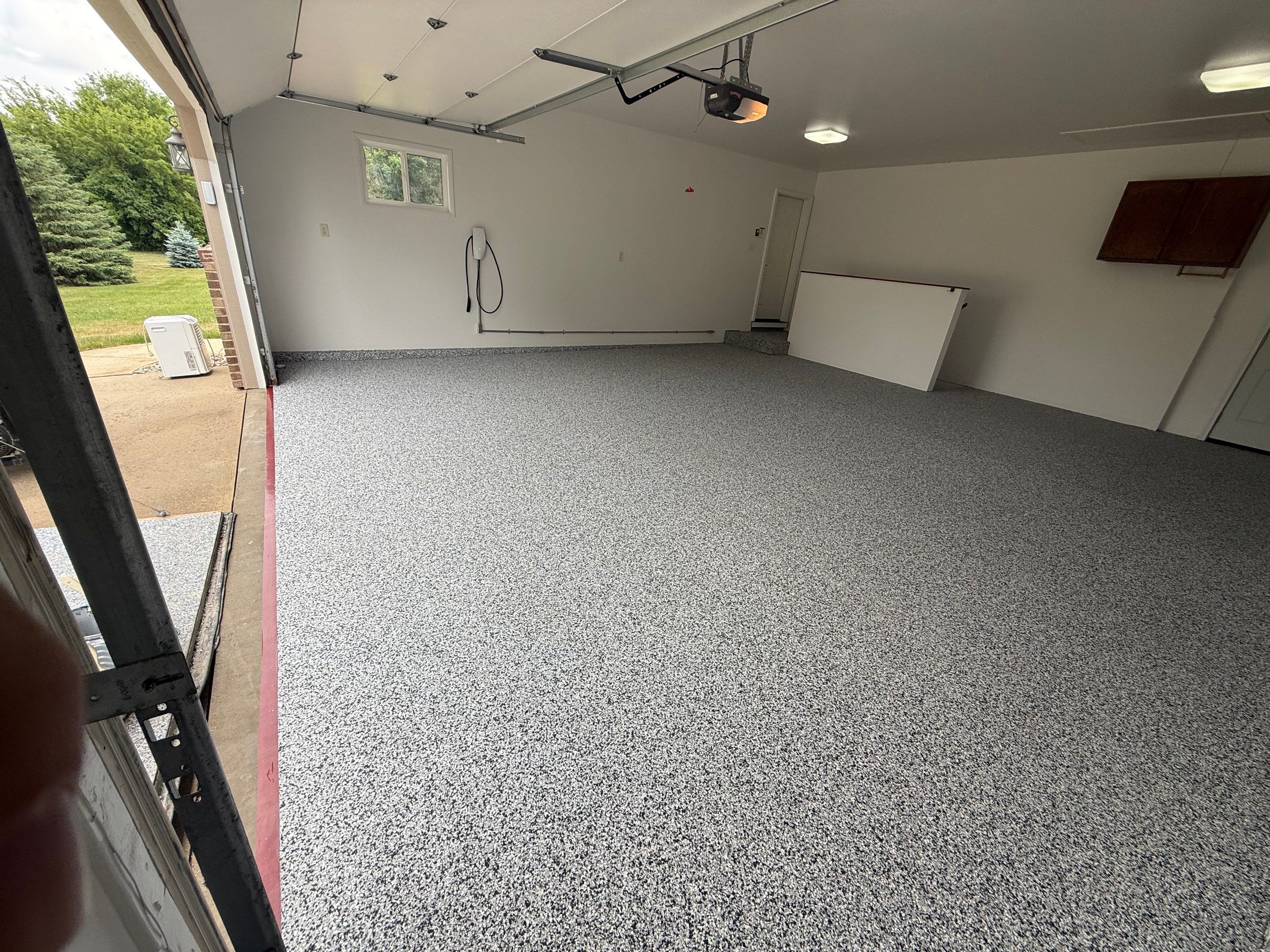 Full Garage Floor and Basement Stair Epoxy Coating in Sioux Falls by Select Painting, Coatings & Garage Cabinets