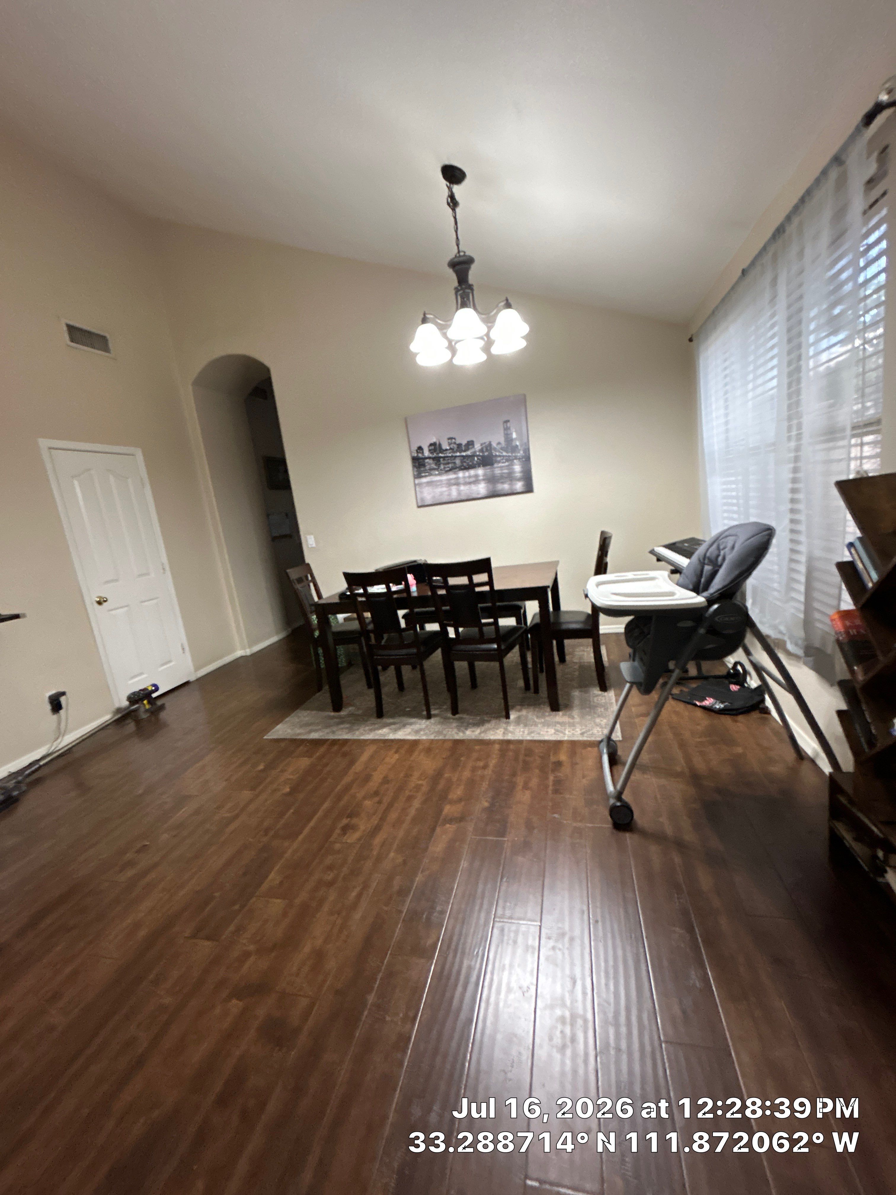 Dark Wood Laminate Flooring Installation for Chandler Dining Room by CompanyCam Sales Demo