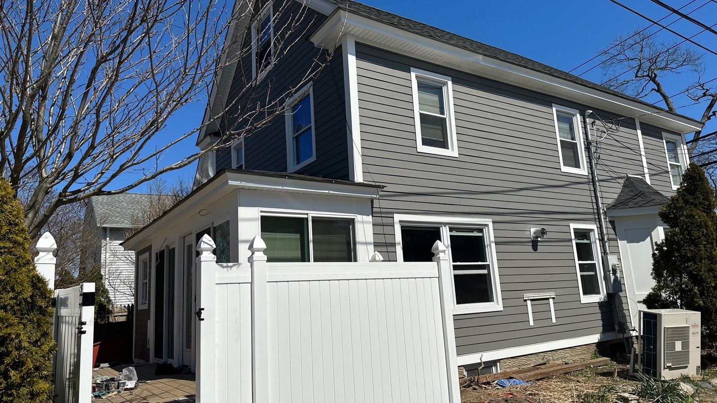 Siding Installation using Hardie Plank Aged Pewter by A Plus Exterior