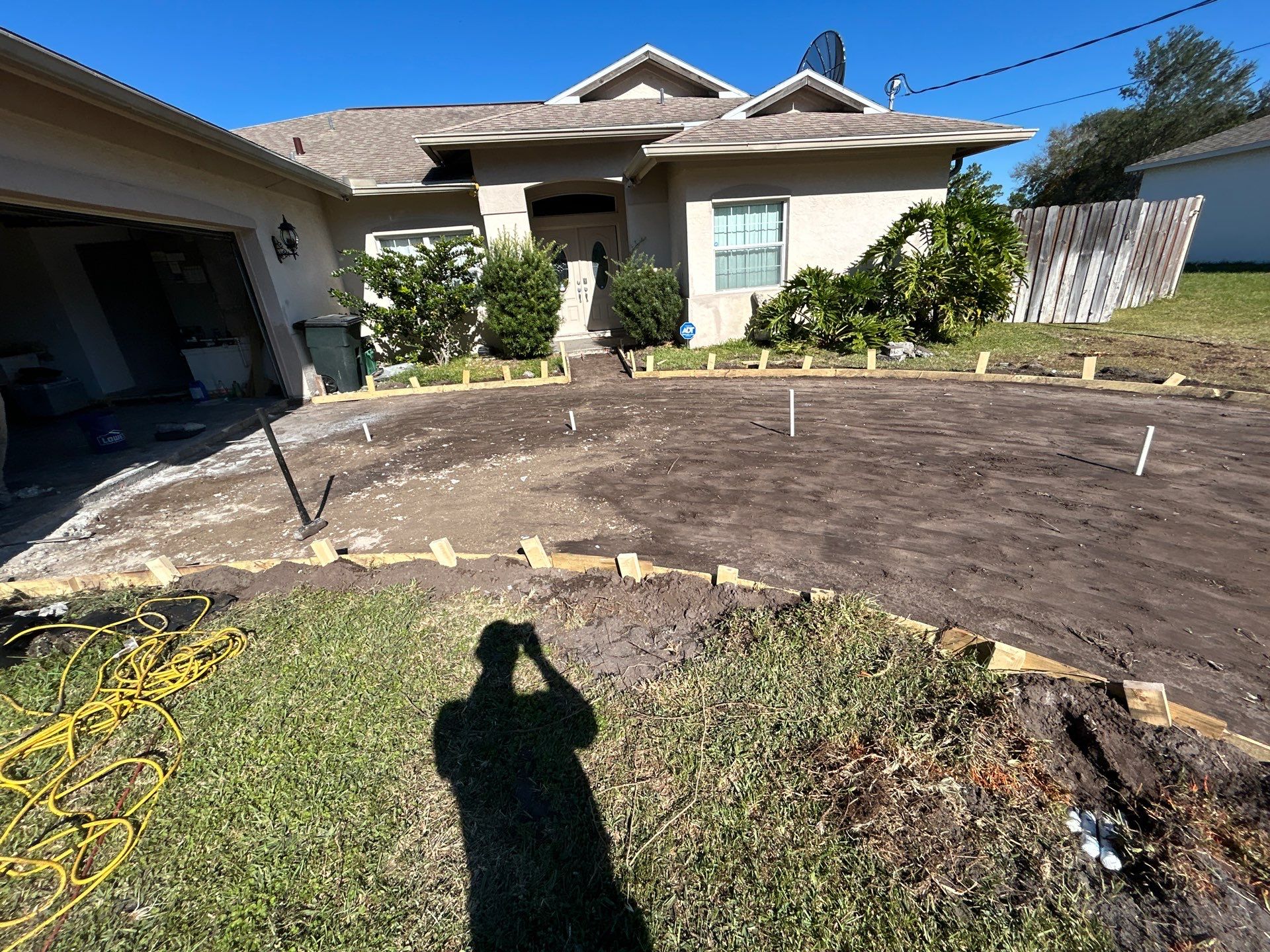New concrete driveway by Courtesy screening