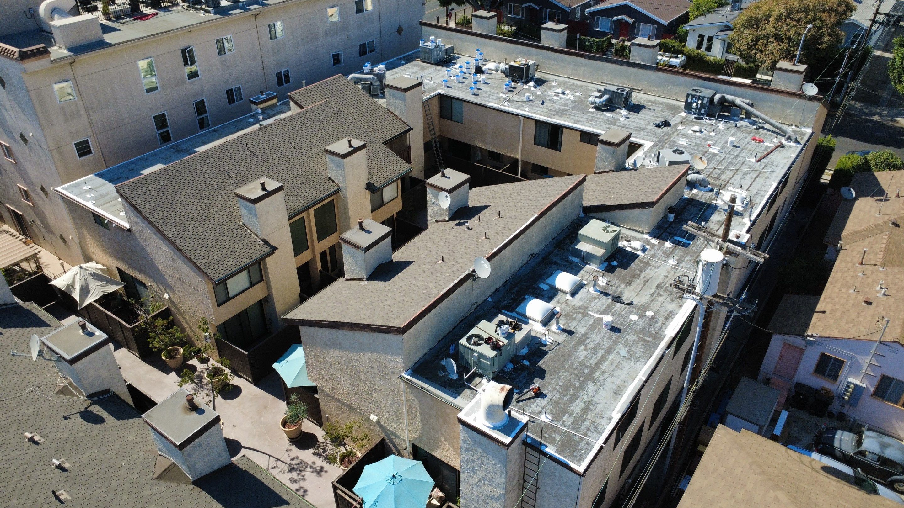 Apartment Building Silicone Coating by Hull Brothers Roofing