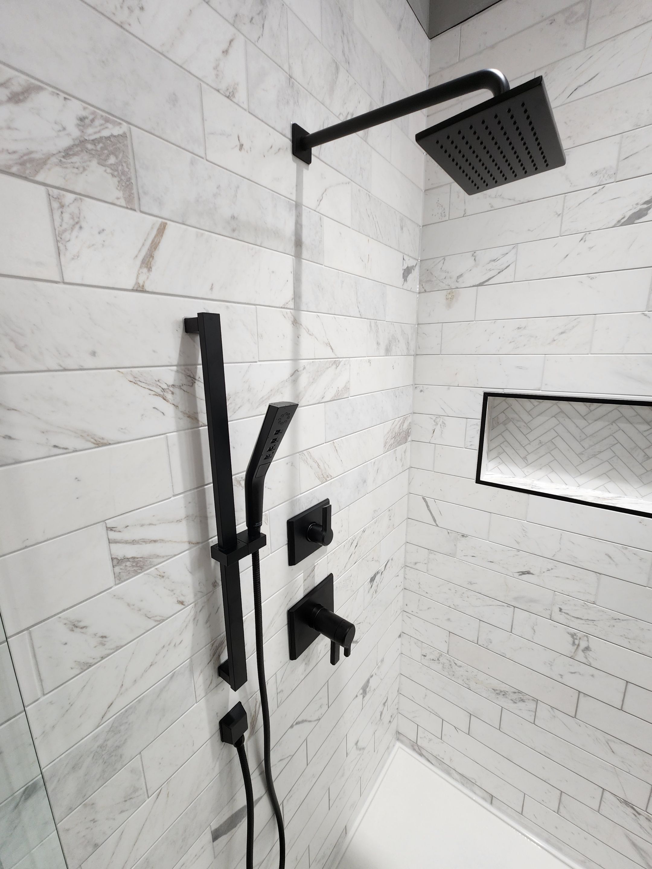 Spring Bathroom Remodel with Black Free-Standing Tub and Walk-In Shower by Legacy Bath and Kitchen